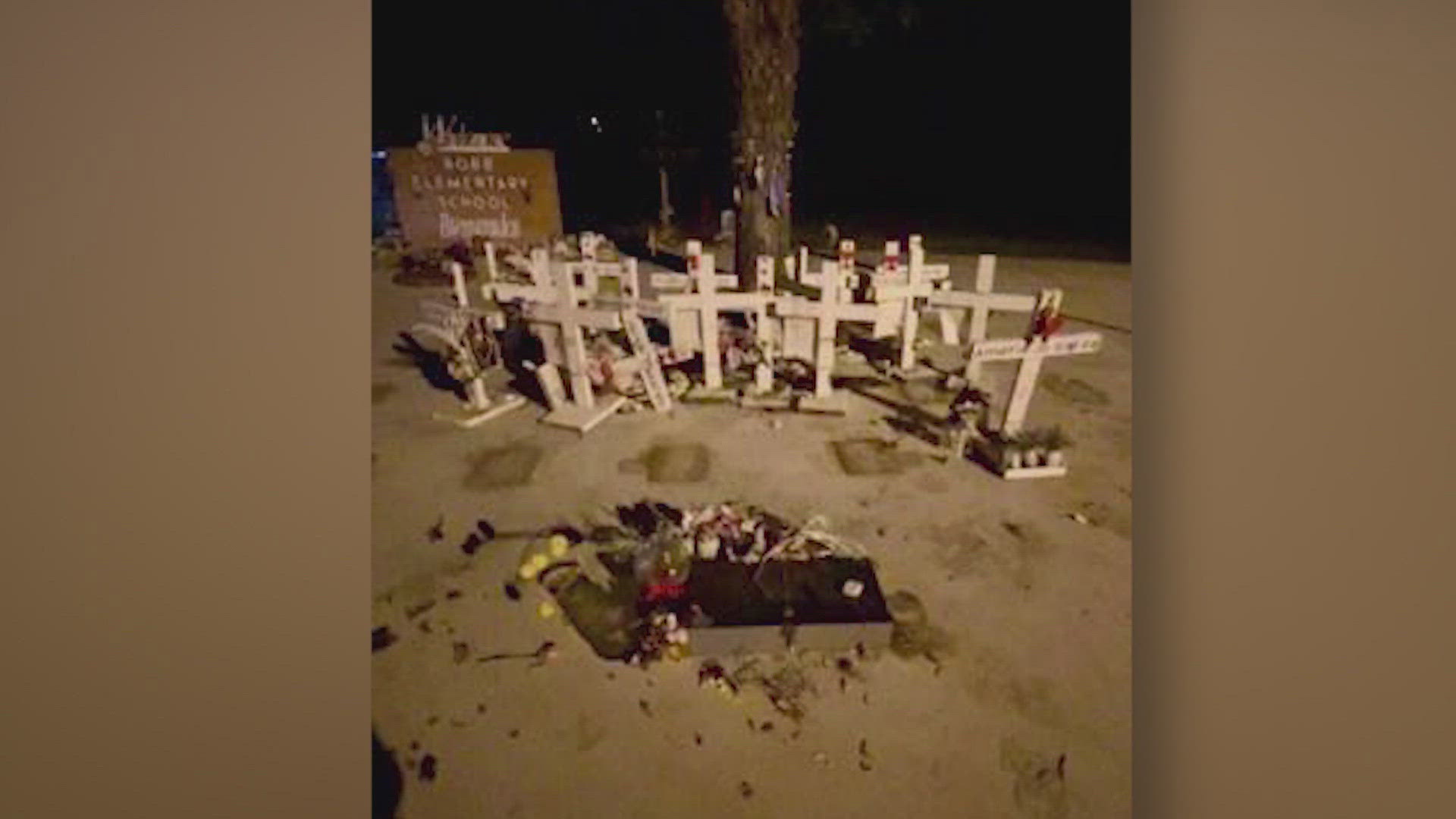 Family members of the victims rushed to the memorial plaza to restore the crosses to their original position.