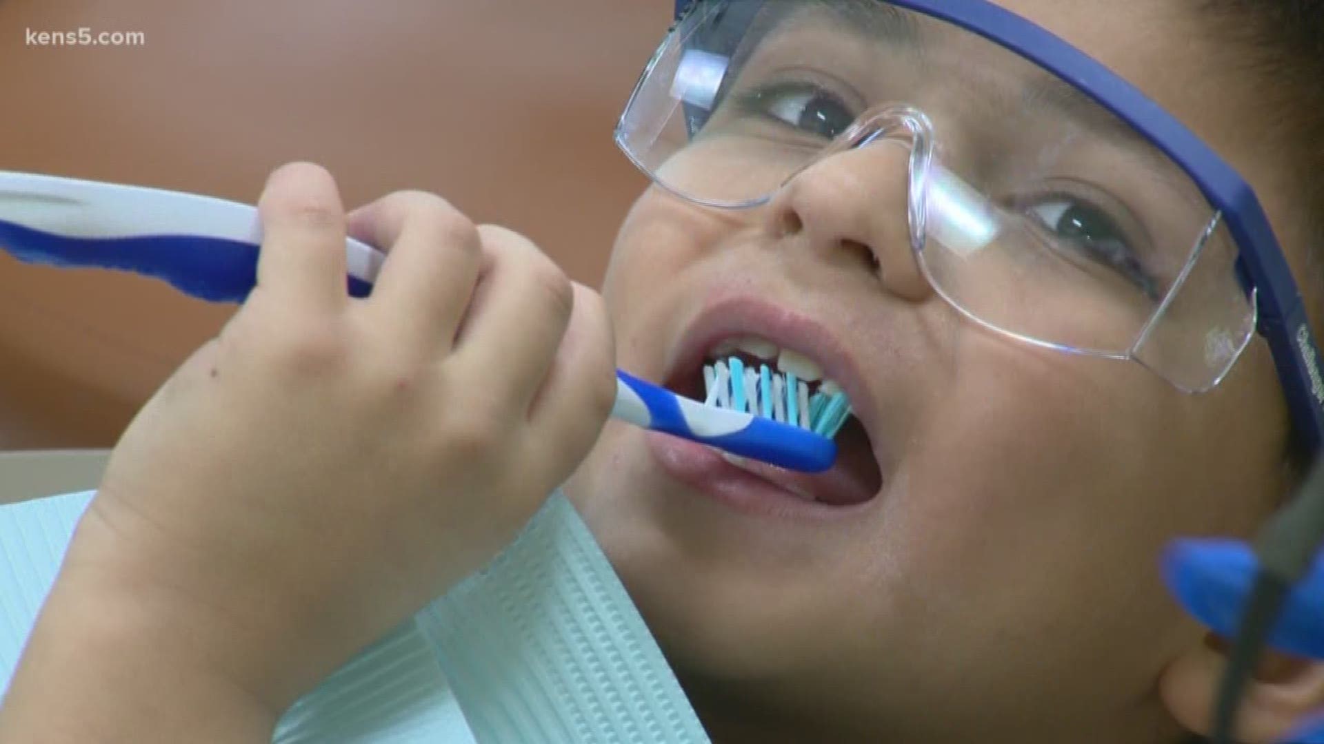 Several dozen kids were bussed to the UT San Antonio's School of Dentistry Friday morning, where they received free dental care from college students.