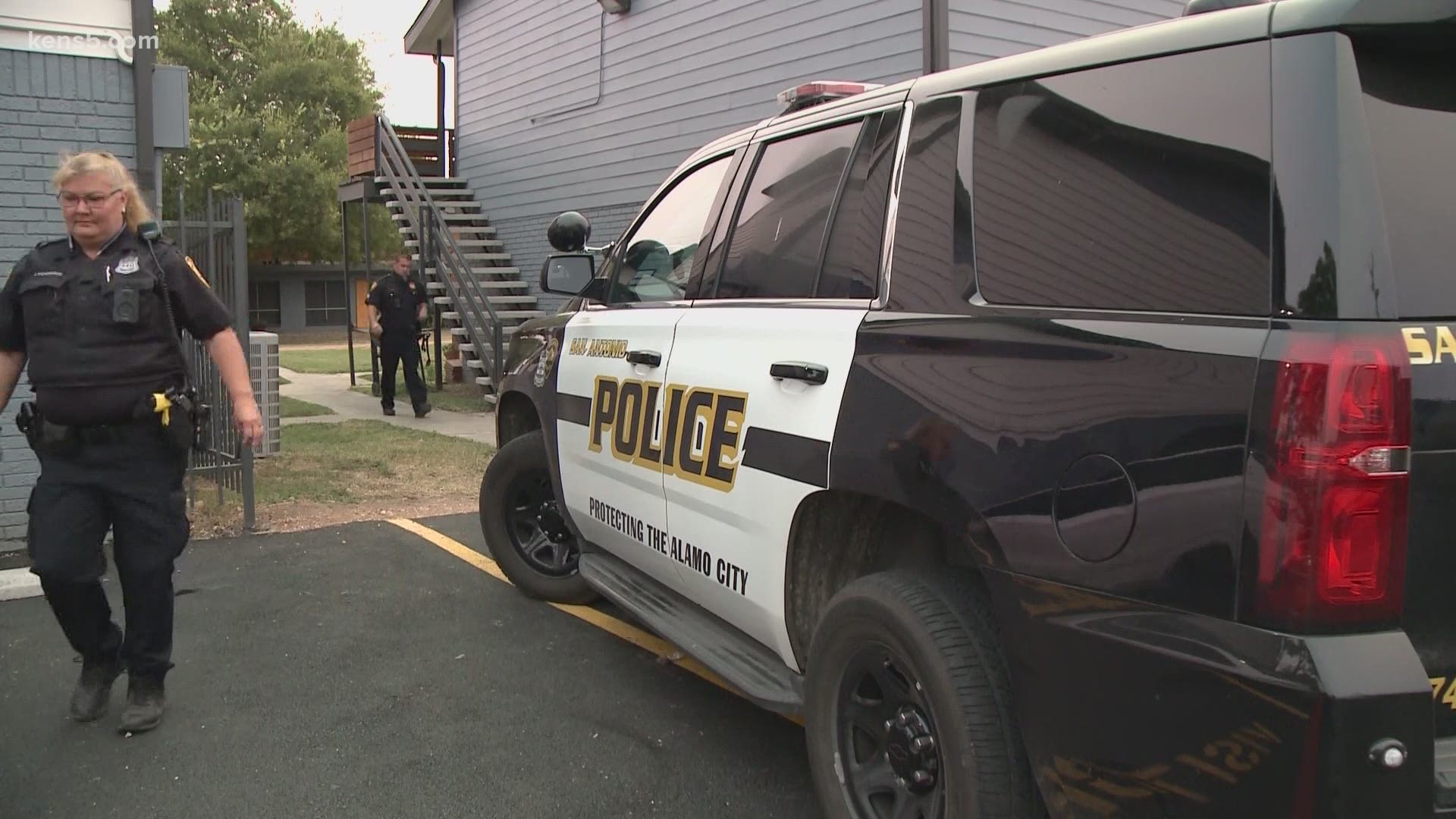 A man rushed to his girlfriend's apartment after being stabbed in the neck while he slept.