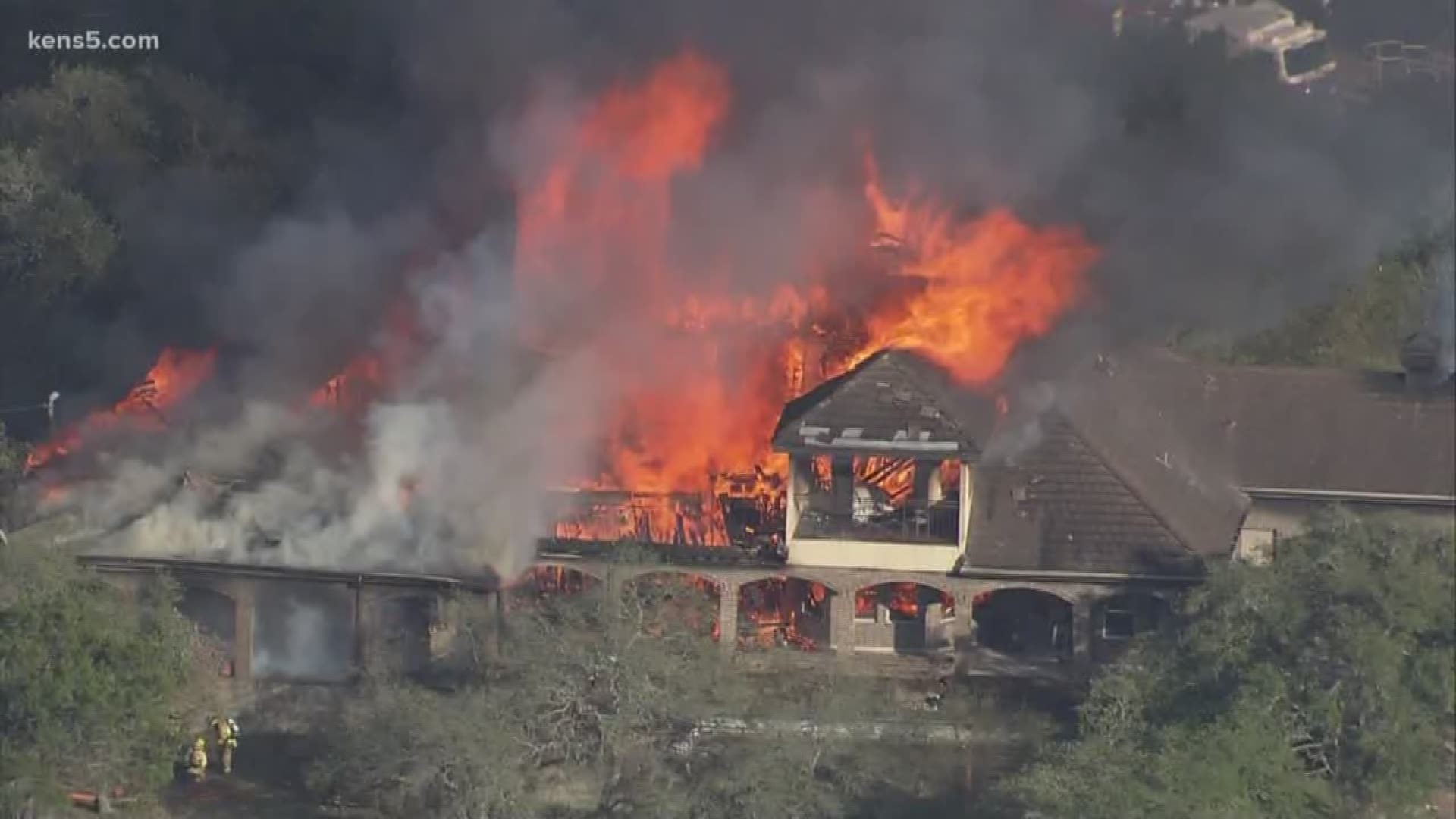 Dramatic video from Chopper 5 shows crews fighting a large fire near Highway 281 and Bulverde Road.