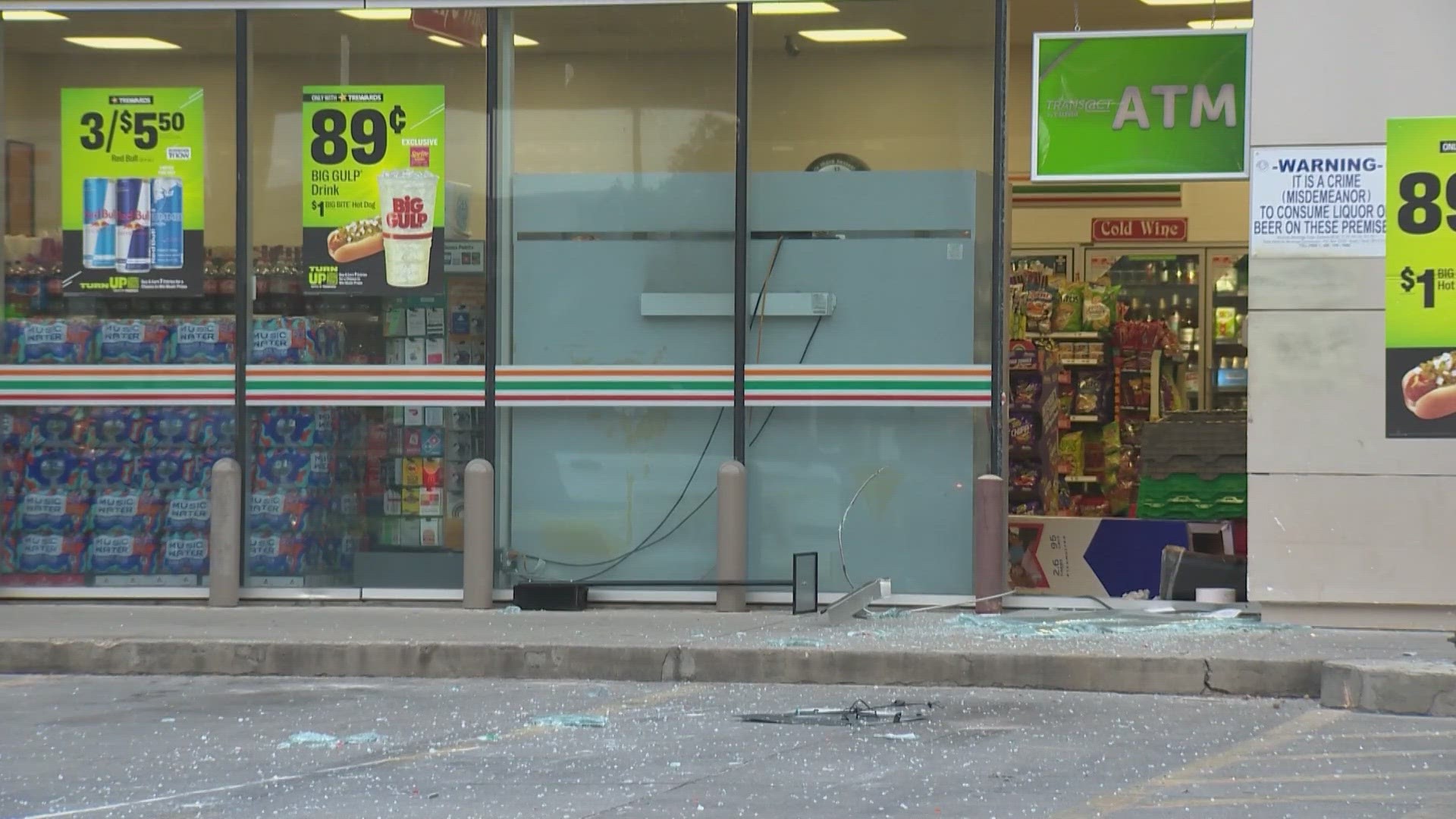 Police say a window was smashed, then a chain wrapped around the cash machine, and it was dragged out of the store by the suspects.