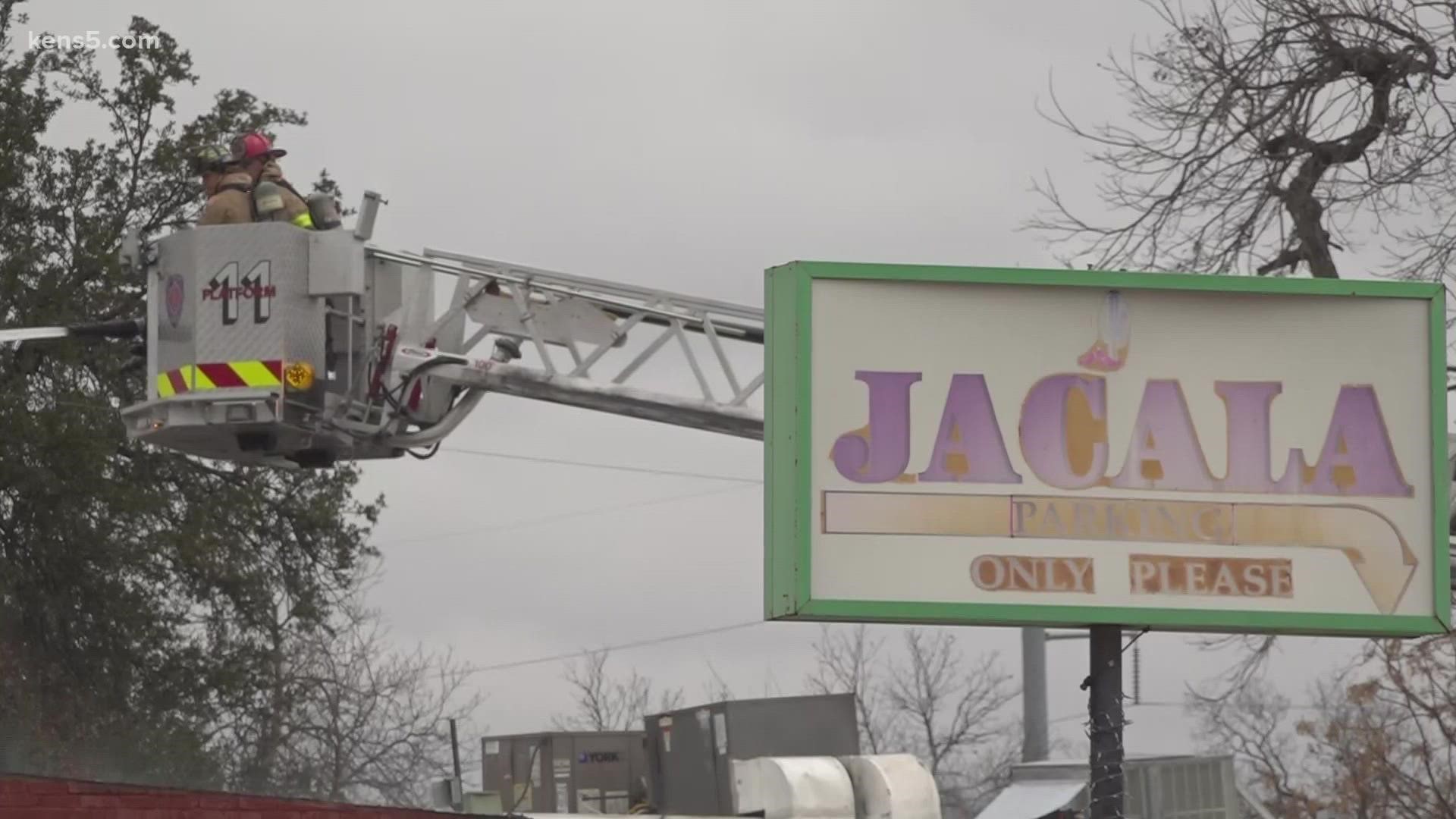 The fire broke out around 6:30 a.m. Five hours later, the building was being torn down after a fire destroyed it.