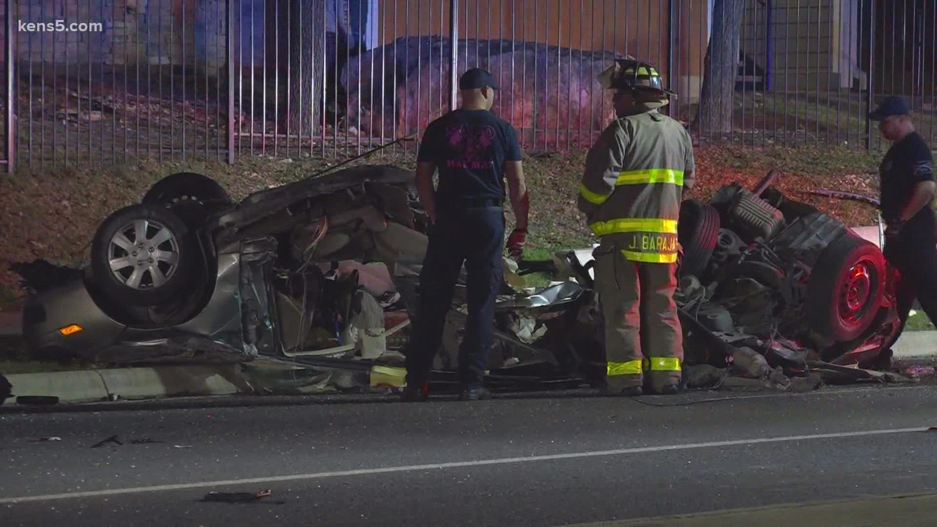 The woman was reportedly trapped inside the car and had to be extricated by San Antonio Fire Department crews.