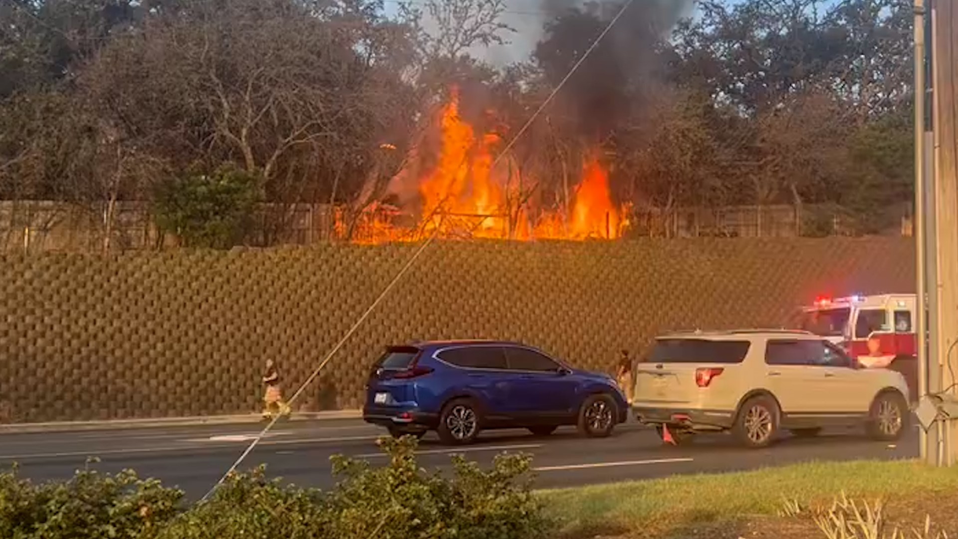 Firefighters put out a huge fire that burned along a residential fence on Fredericksburg Road Monday morning.