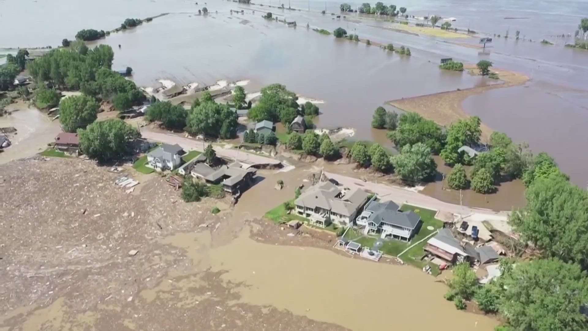 Raging rivers, collapsed roads and homes swept away. Officials say Midwest floods have now claimed two lives.