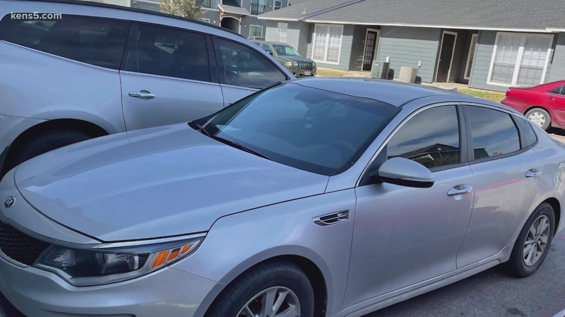 The 2018 Kia Optima was taken from apartments on the west side, and security footage shows a possible suspect.