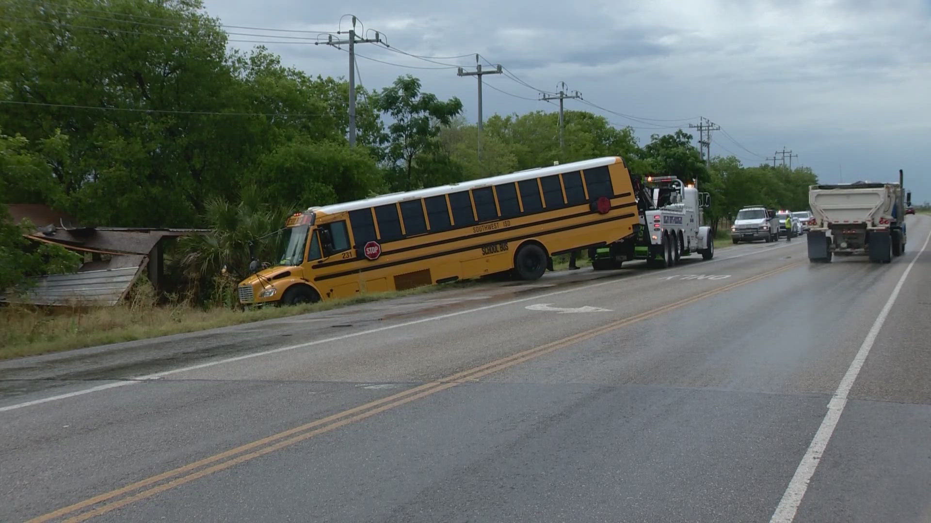 The bus was reportedly carrying nine summer school students. No one was injured in the crash.