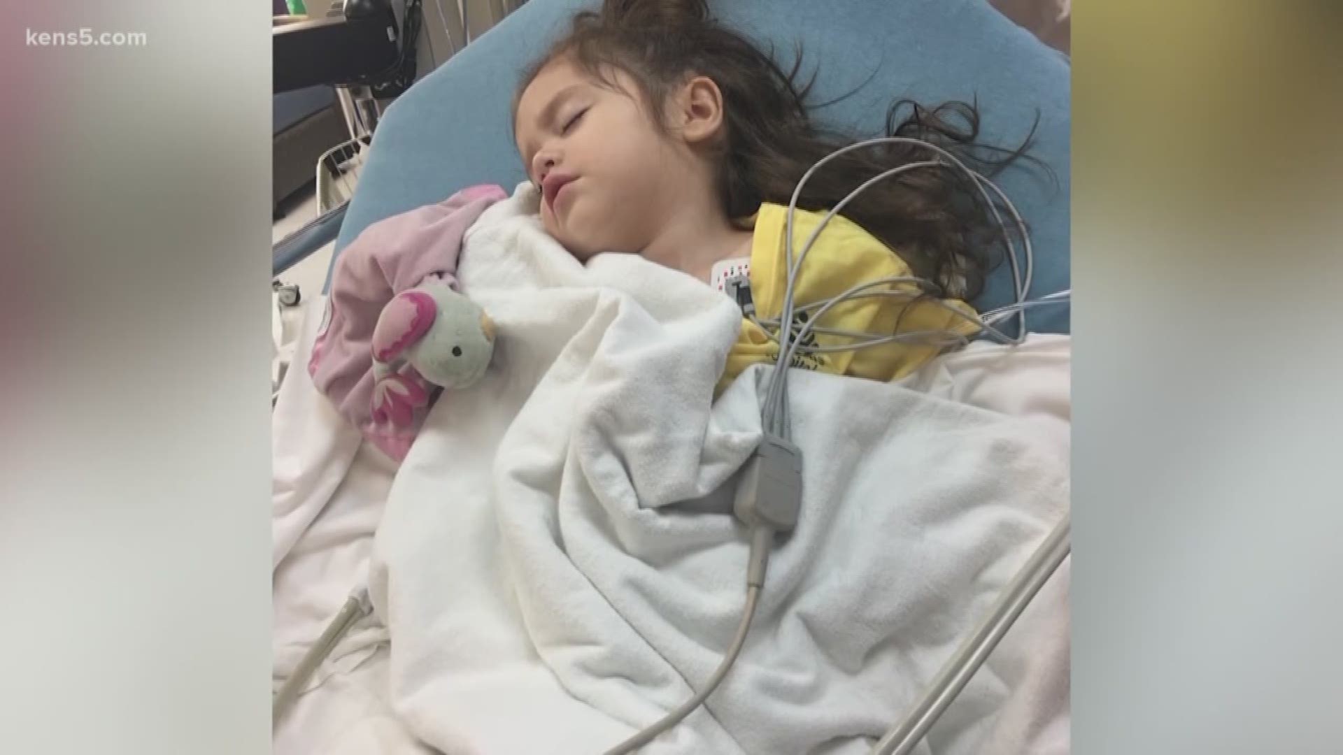 A San Antonio family is spreading awareness about childhood cancer after they snapped a photo of their youngest daughter and notice something was not right.