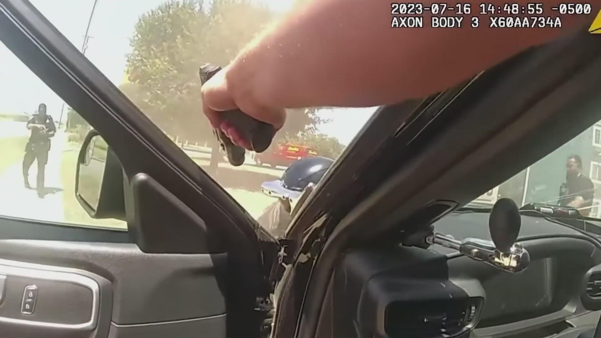 Video from police appeared to show that the man was holding a gun as he fled, and an officer in a car shot him as he approached. Viewer discretion is advised.