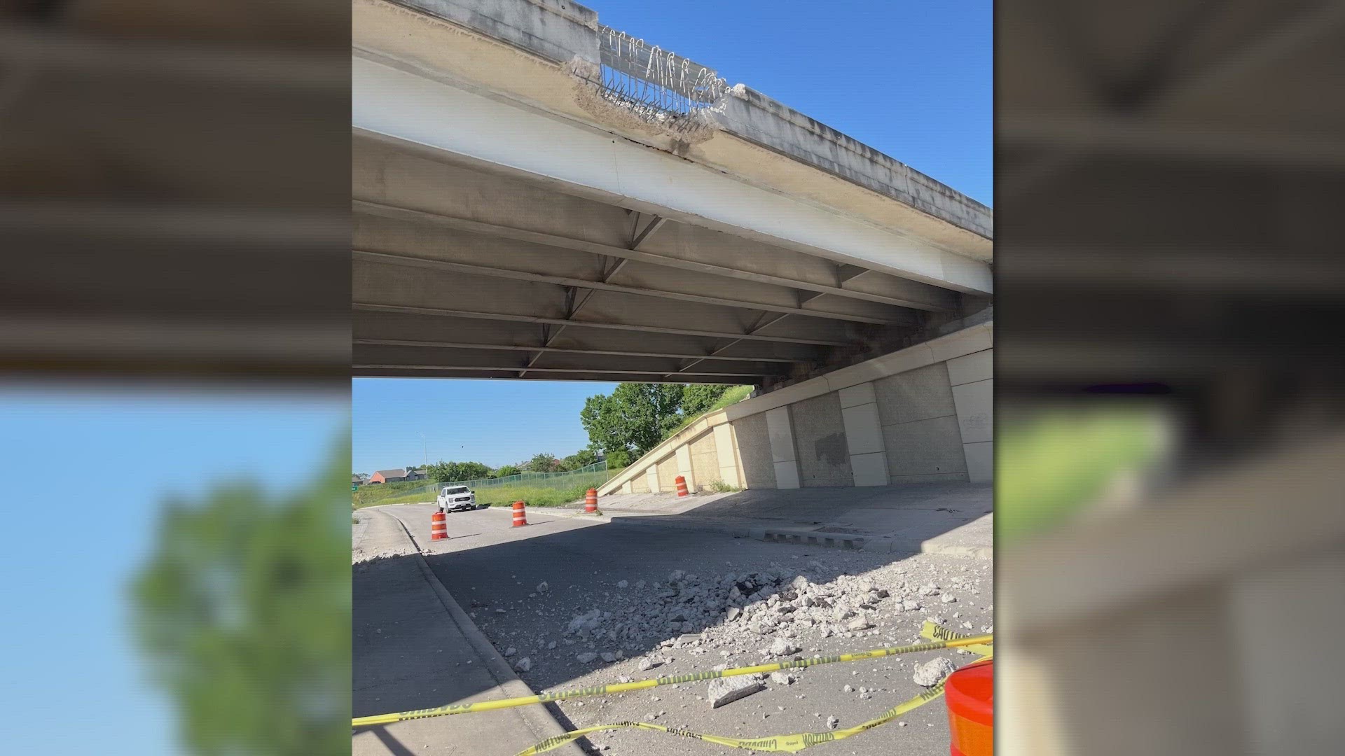 Crumbling highway wall debris narrowly misses pedestrian