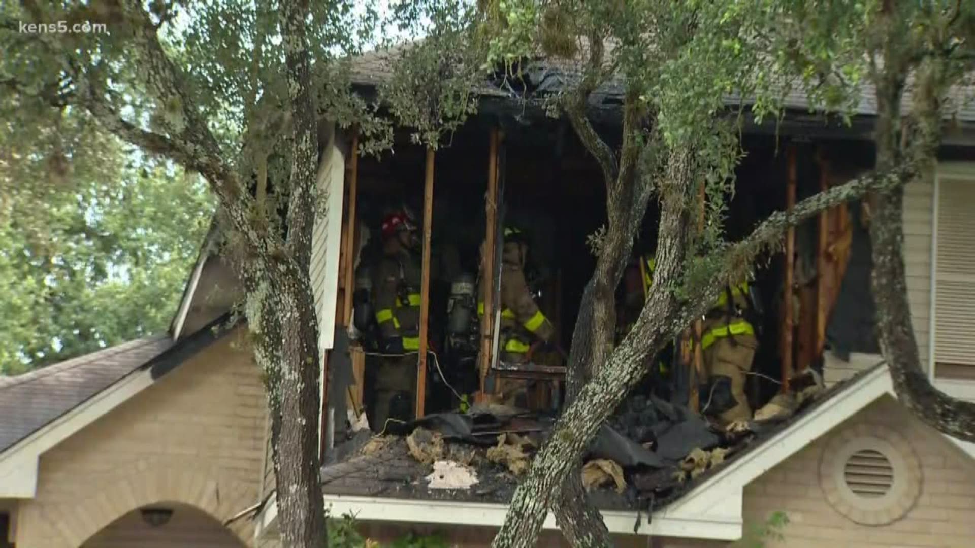 The family says it wasn't aware the house was burning until a neighbor started banging on the door.