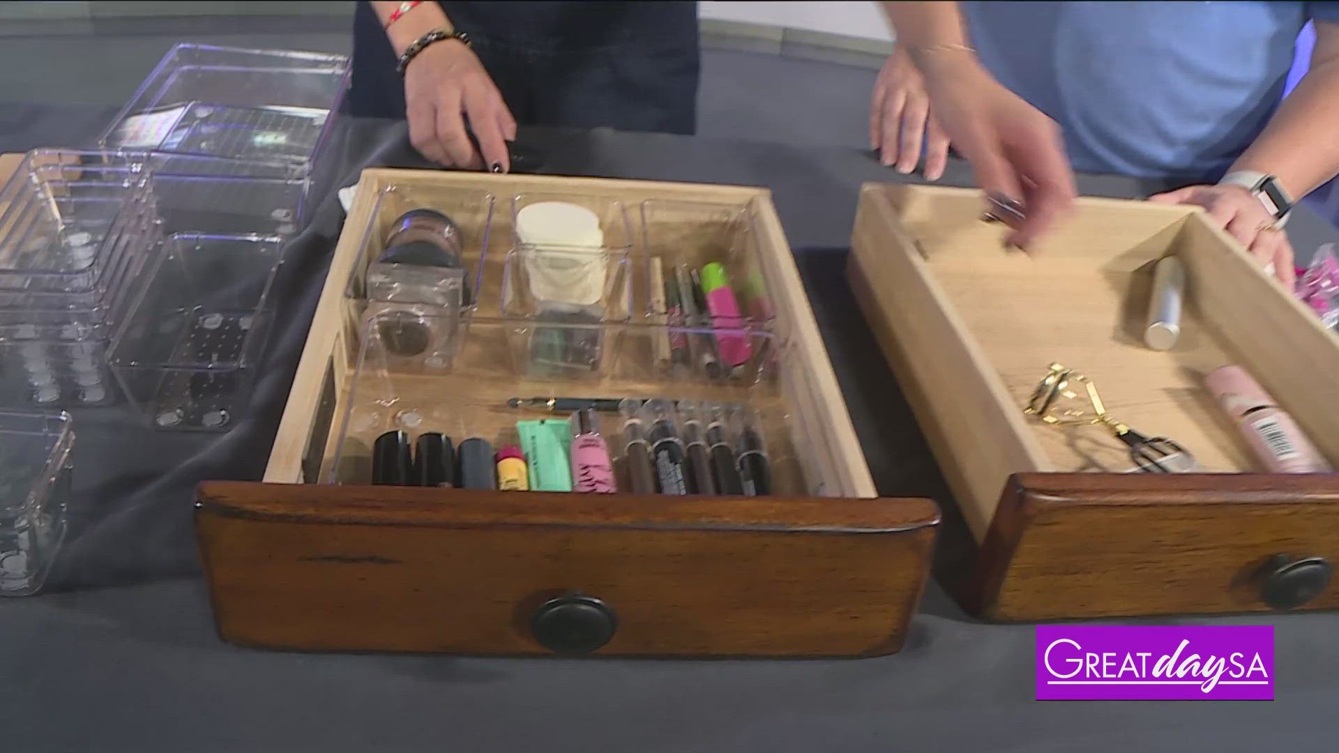 Heather Clark with Alamo Organizers teaches Roma how to clean & organize a messy make-up drawer.