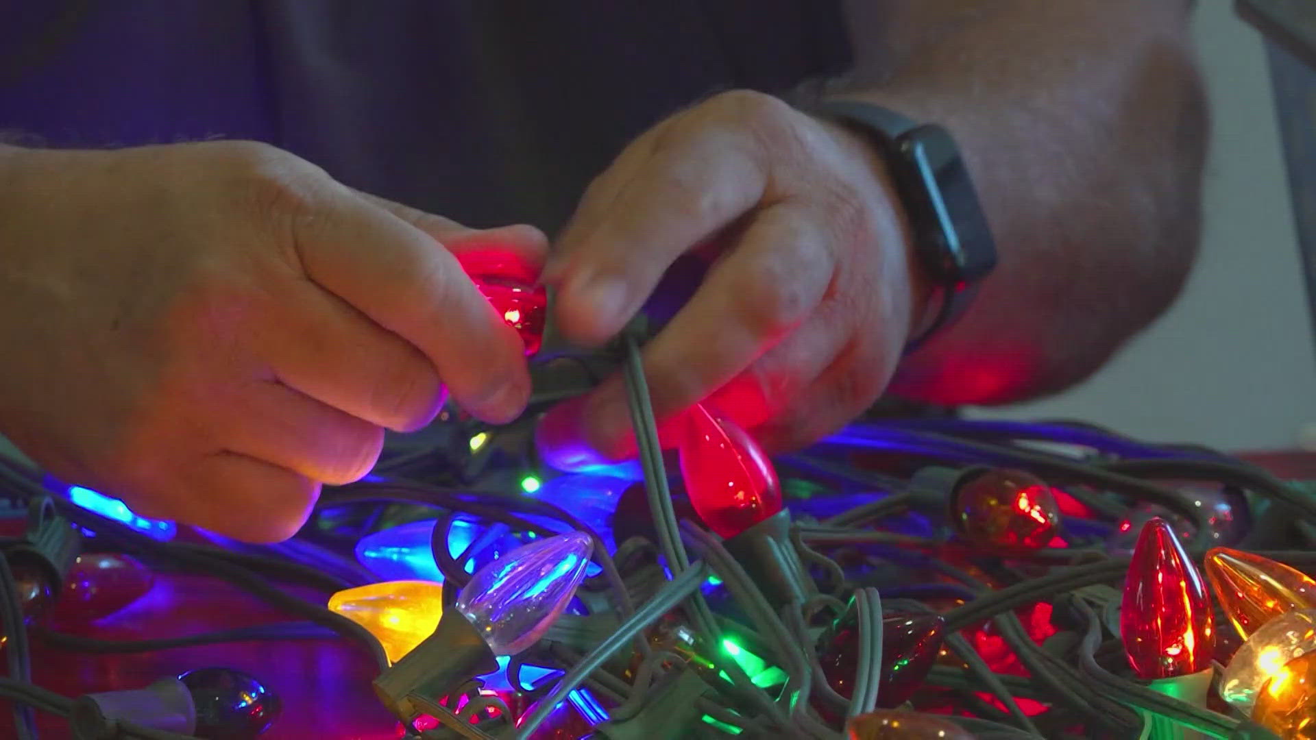 Before these lights can be flipped on for the holiday season, dozens of volunteers need to replace worn and broken bulbs on every single string of lights.