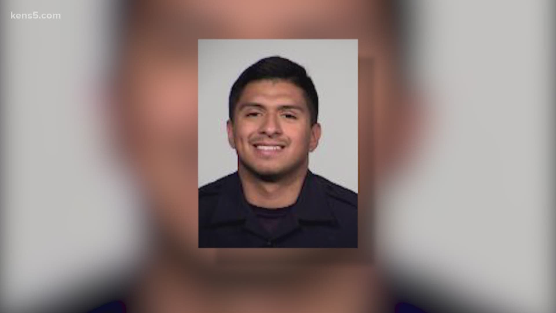 The 23-year-old officer has been placed on leave, and is being charged with assault family violence.