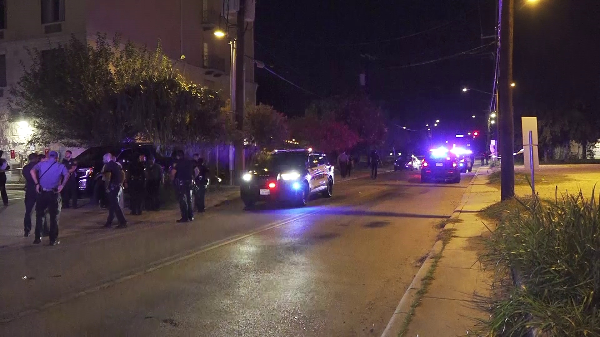 Someone involved in the fight pulled out a gun and tried to shoot a security guard, but missed and hit the woman in the leg.