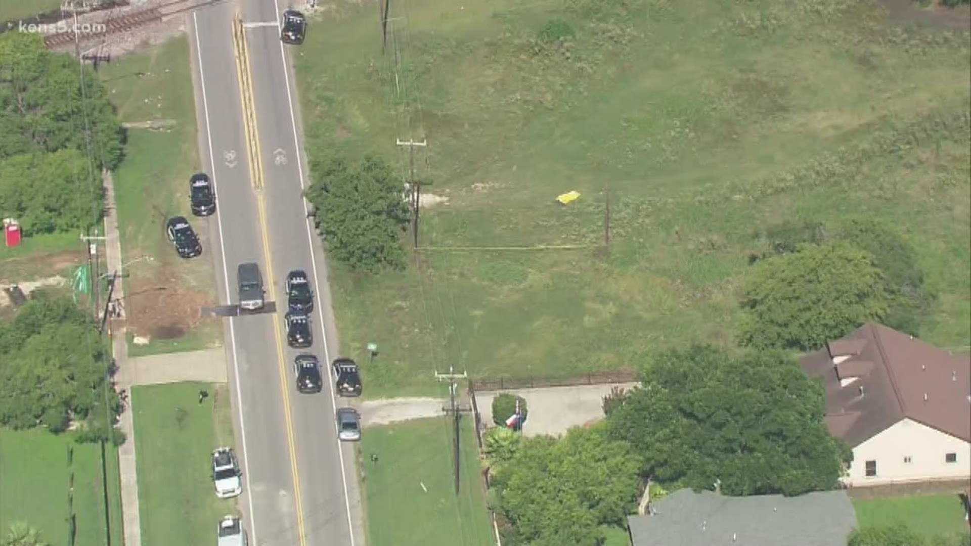 San Antonio police are investigating a suspicious death on the city's south side, where a body was found in a field next to a home.
