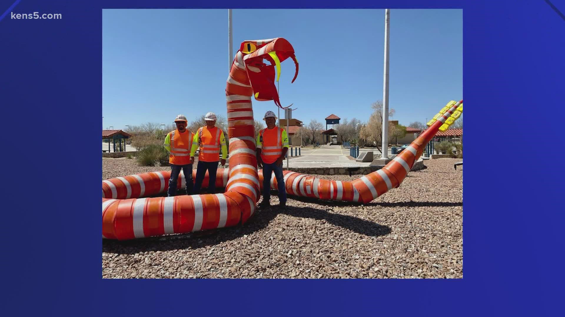 The snake was constructed with traffic barrels.