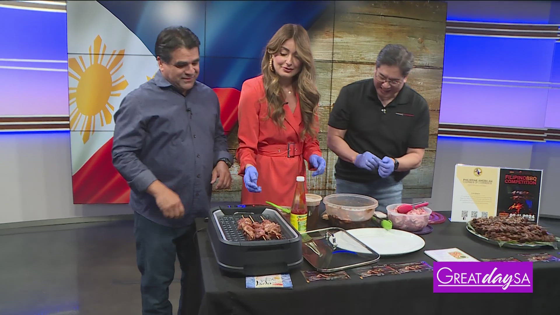 Roma helps make some delicious pork skewers with Gene Carangal with the Adobo Throwdown.