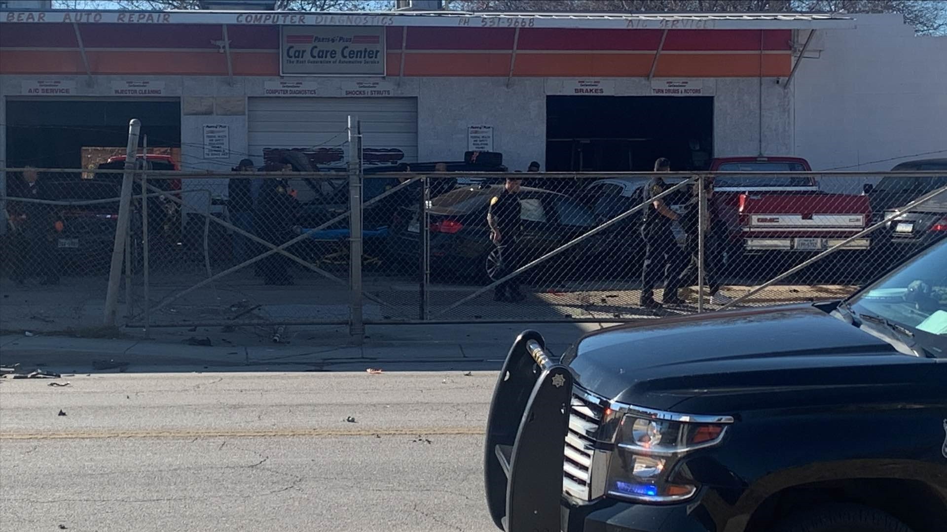 San Antonio authorities said the young driver crashed into a car on the road before jumping a curb, crashing through a fence, and trapping a man under a vehicle.
