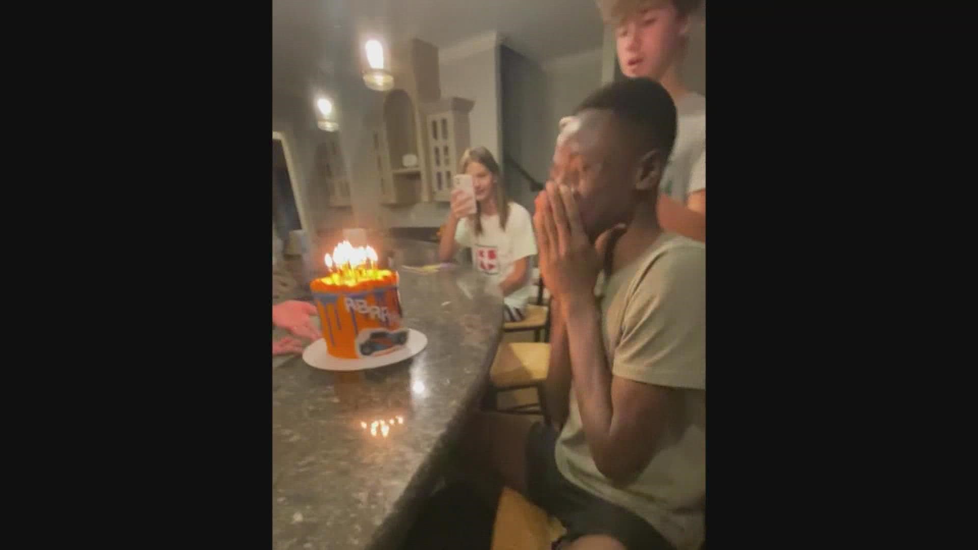 Abraham had never celebrated or knew it was his birthday. His adopted family got him a cake and sang him 'Happy Birthday' and it brought him to tears.