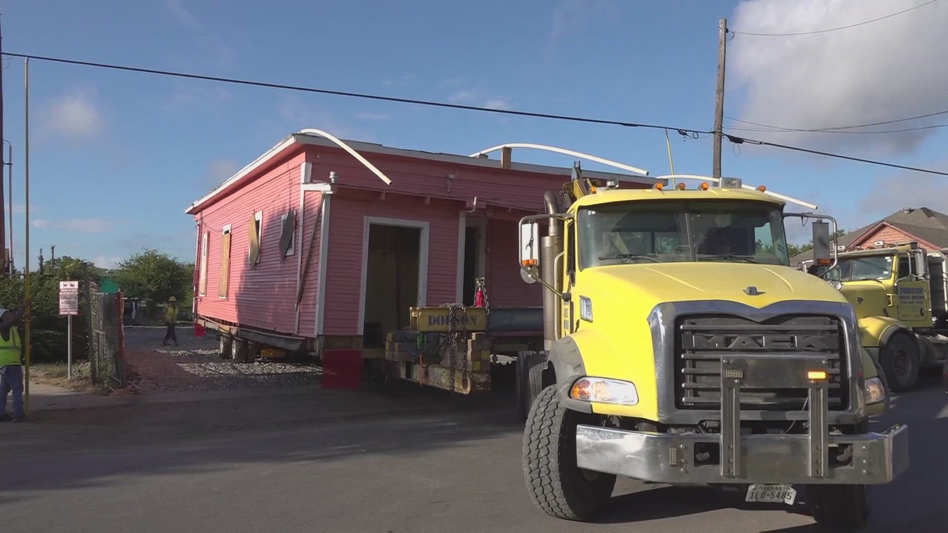 A housing group saves a historic home while adding new affordable apartments.