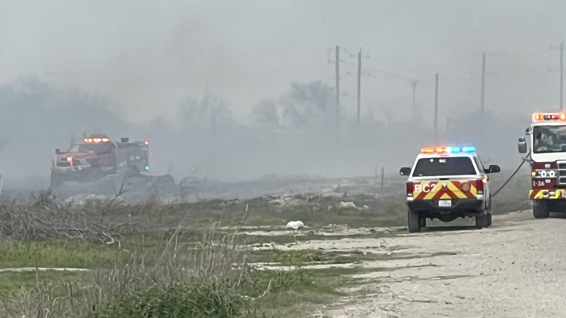SAFD said crews are still trying to put out a fire in a pasture along Interstate 35.