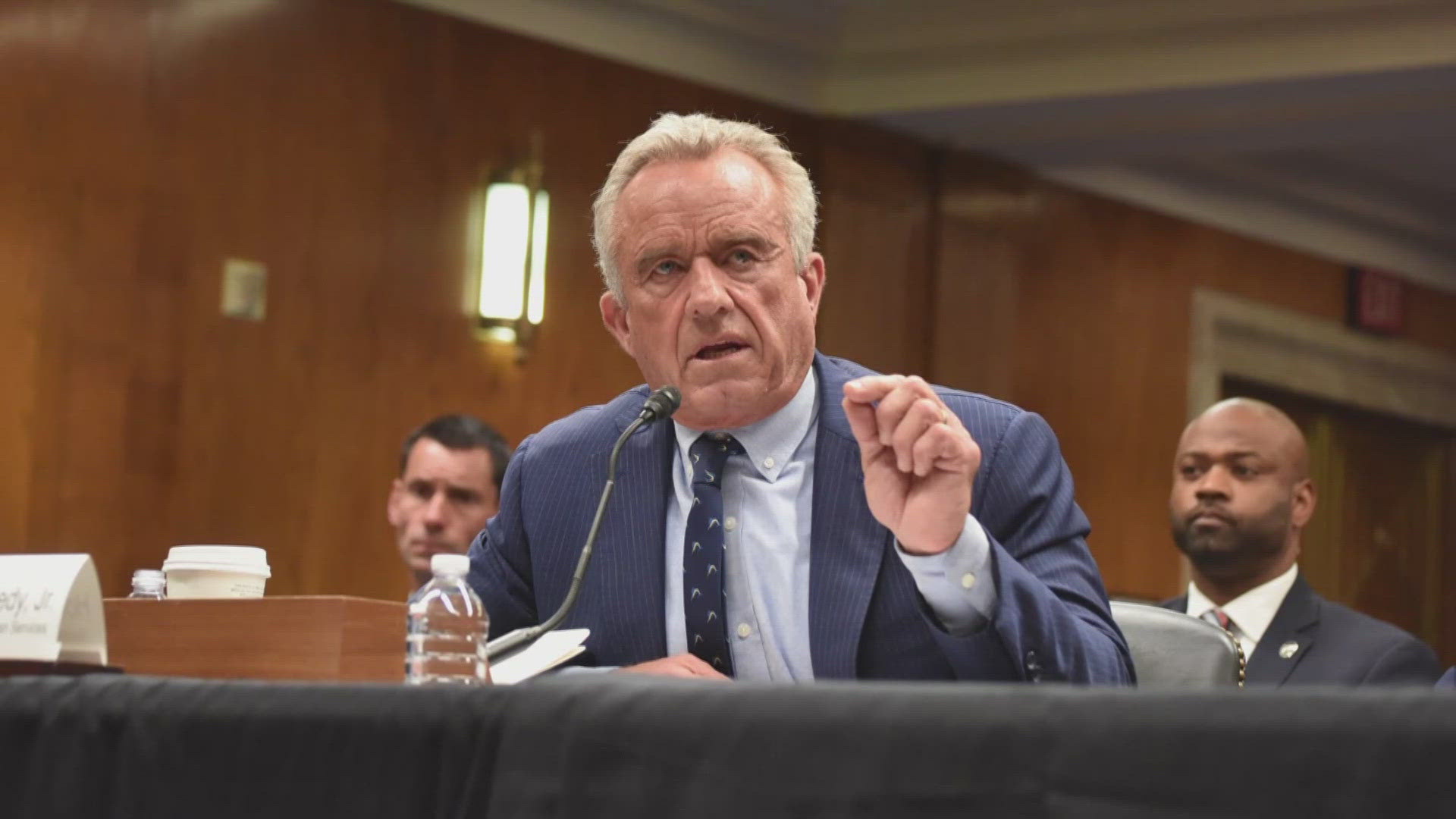 Robert F. Kennedy Jr. is removing the 17 members, saying the panel is plagued with conflicts of interest. 