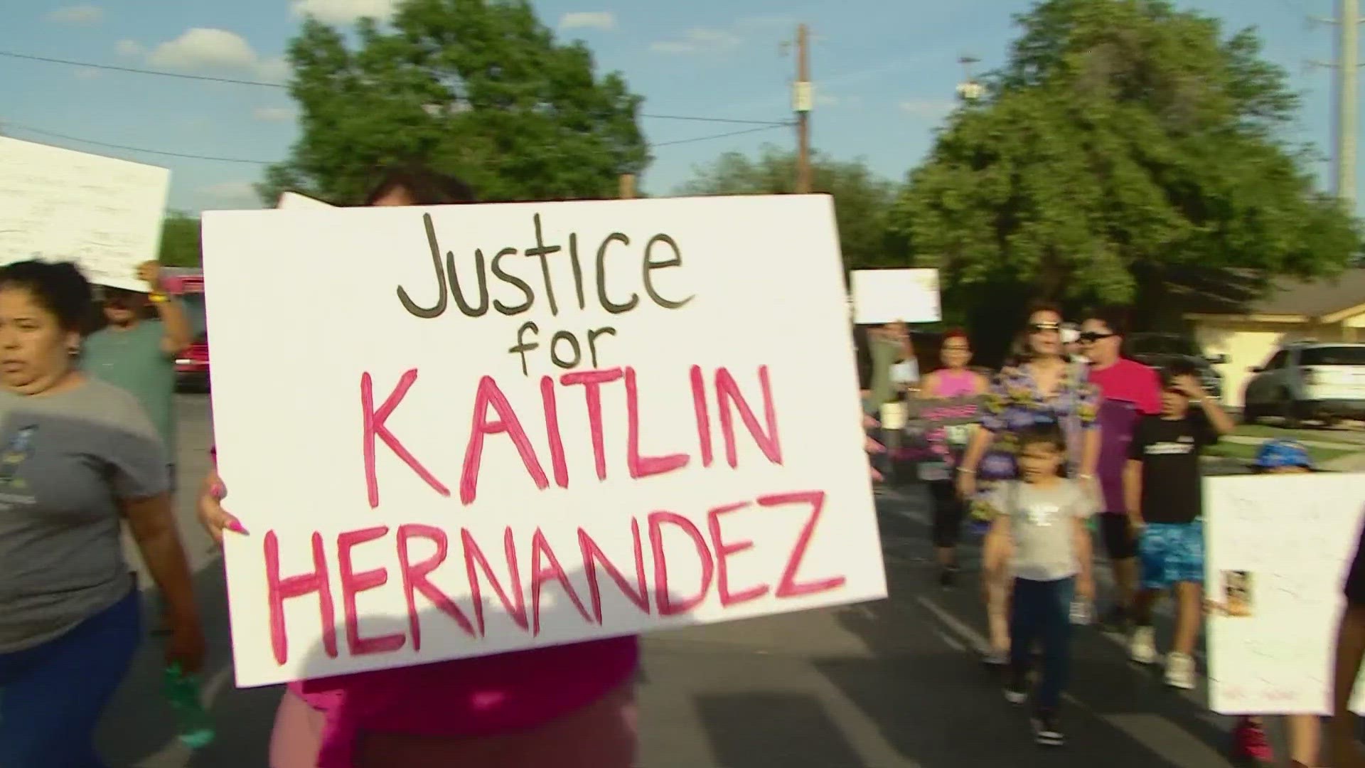 Dozens marched around the neighborhood of Kaitlin Hernandez calling for justice over a month after the teen was found strangled in a ditch.