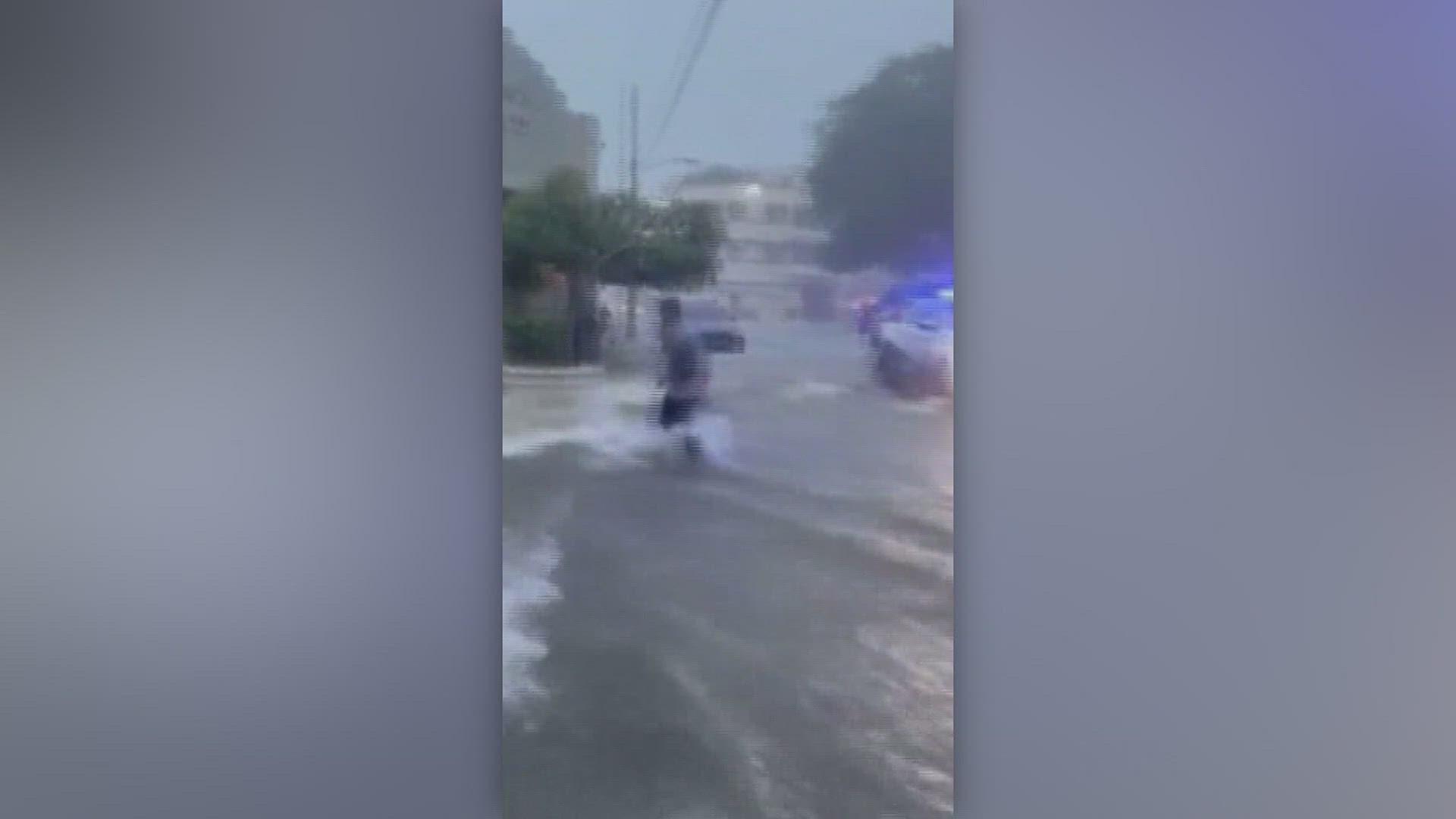 You can see rushing water dragging cars down streets, and flooding buildings.