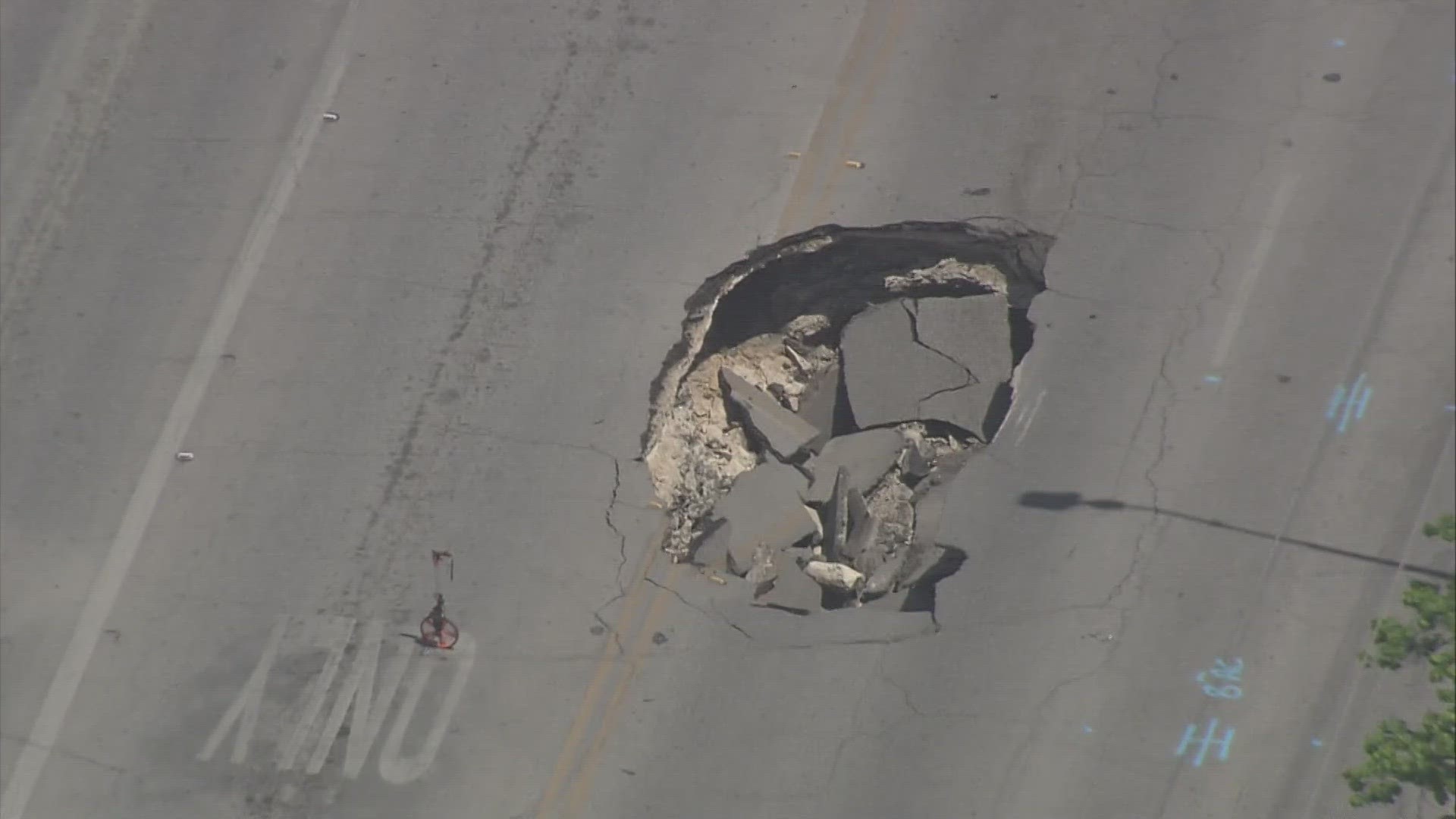 The car-sized crater in the road was caused by a faulty storm drain pipe, officials said. Crews will be working on Culebra for several days.