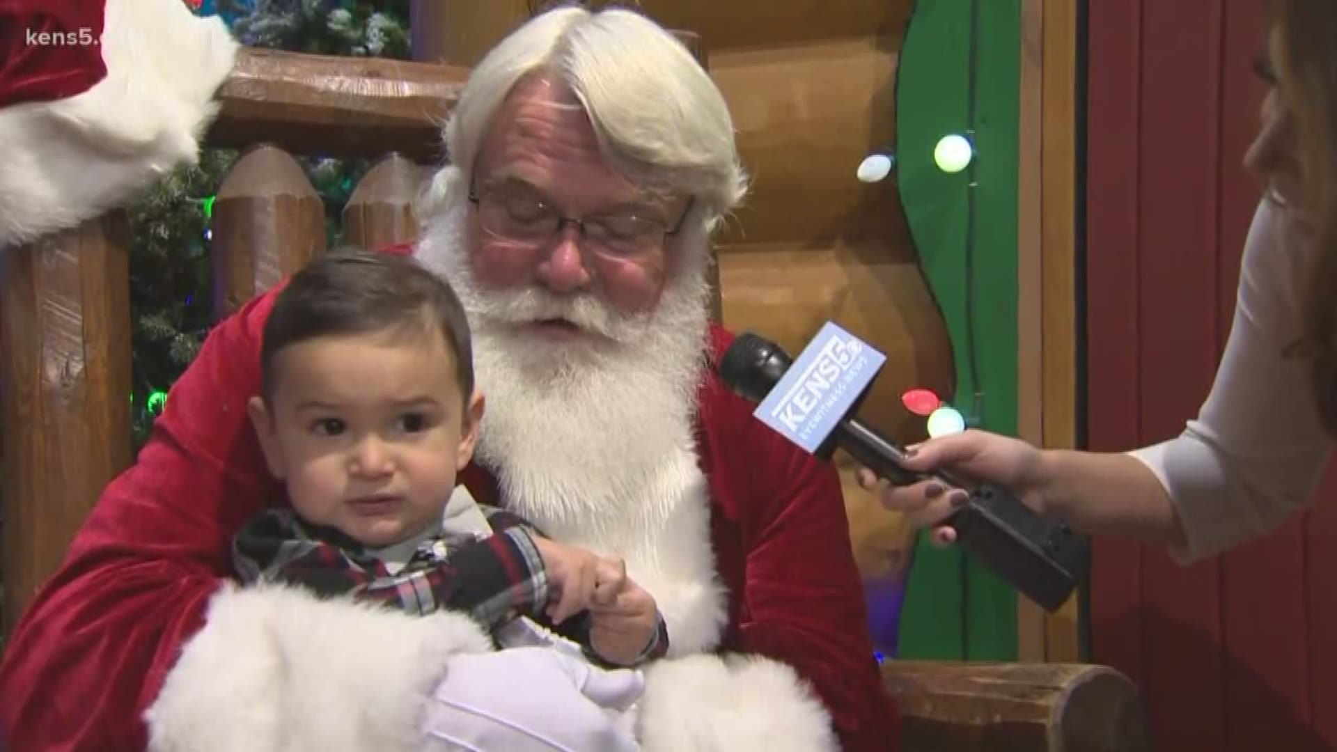 Little Javier gives his Christmas wish list to Santa at Bass Pro Shops.