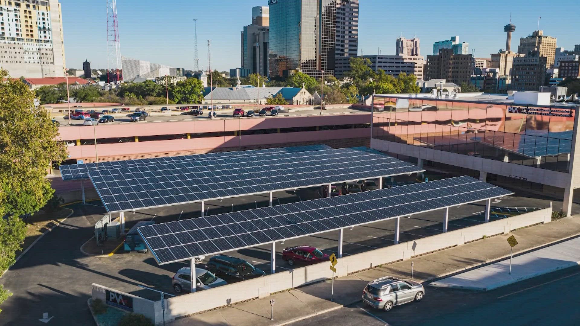 Th project would put panels on rooftops and over parking areas across the city.