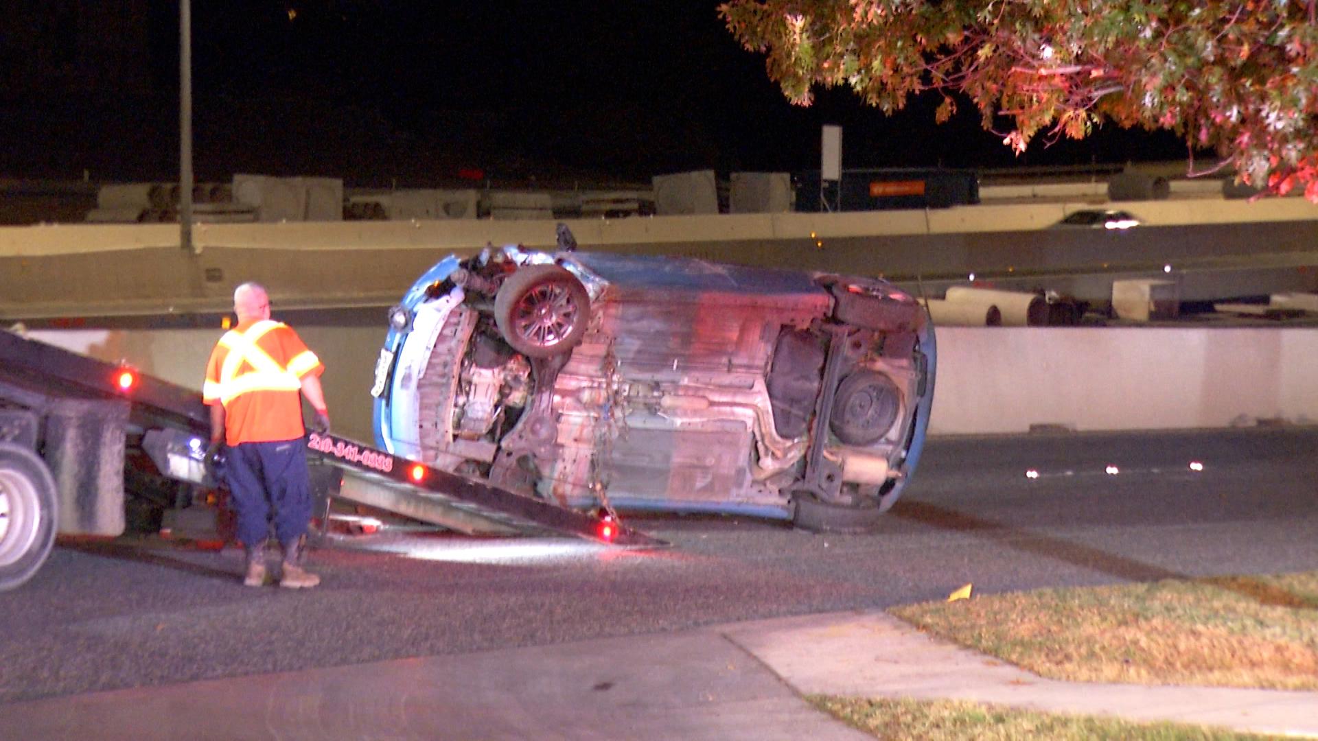 Police tell us the man hit the barrels near a ramp, causing his car to roll over and trapping him inside.