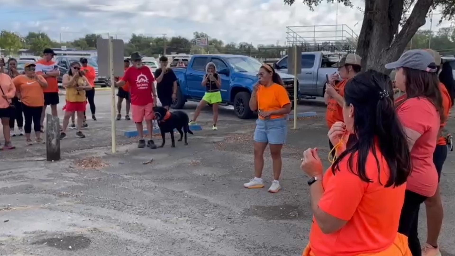 People gathered in the area near where Dramiga began her journey for a two-mile hike to honor her memory and encourage everyone to be safe while they hike.