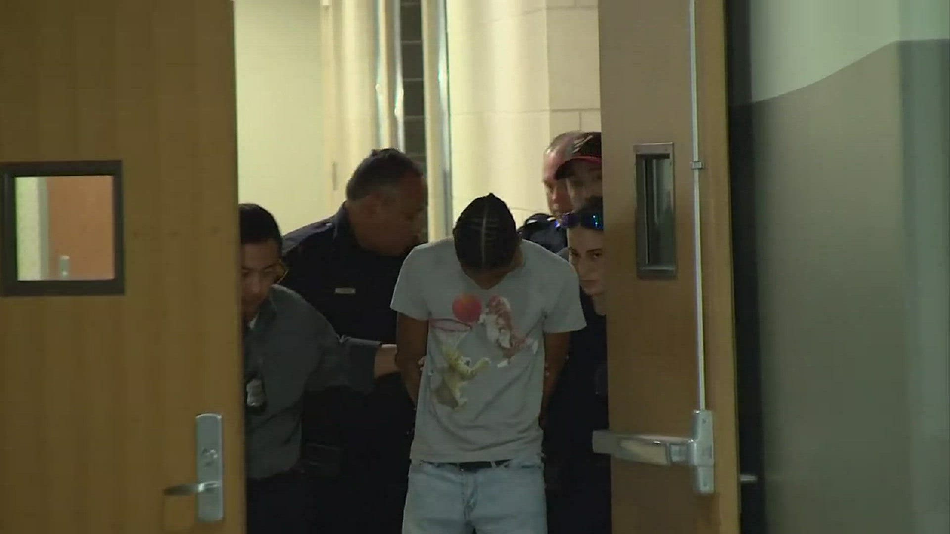 SAPD walks 18-year-old Anton Jamail Harris into a police car in front of the media after he was arrested for allegedly sexually assaulting six women in the Medical Center area.