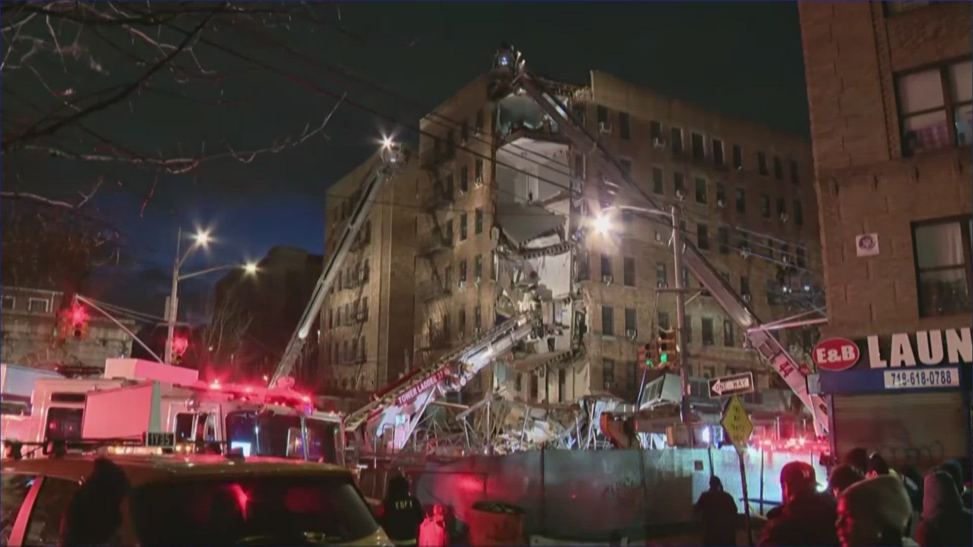 News video shows a corner of the building with its walls sheared off and floors sagging, and a heap of rubble in the street.