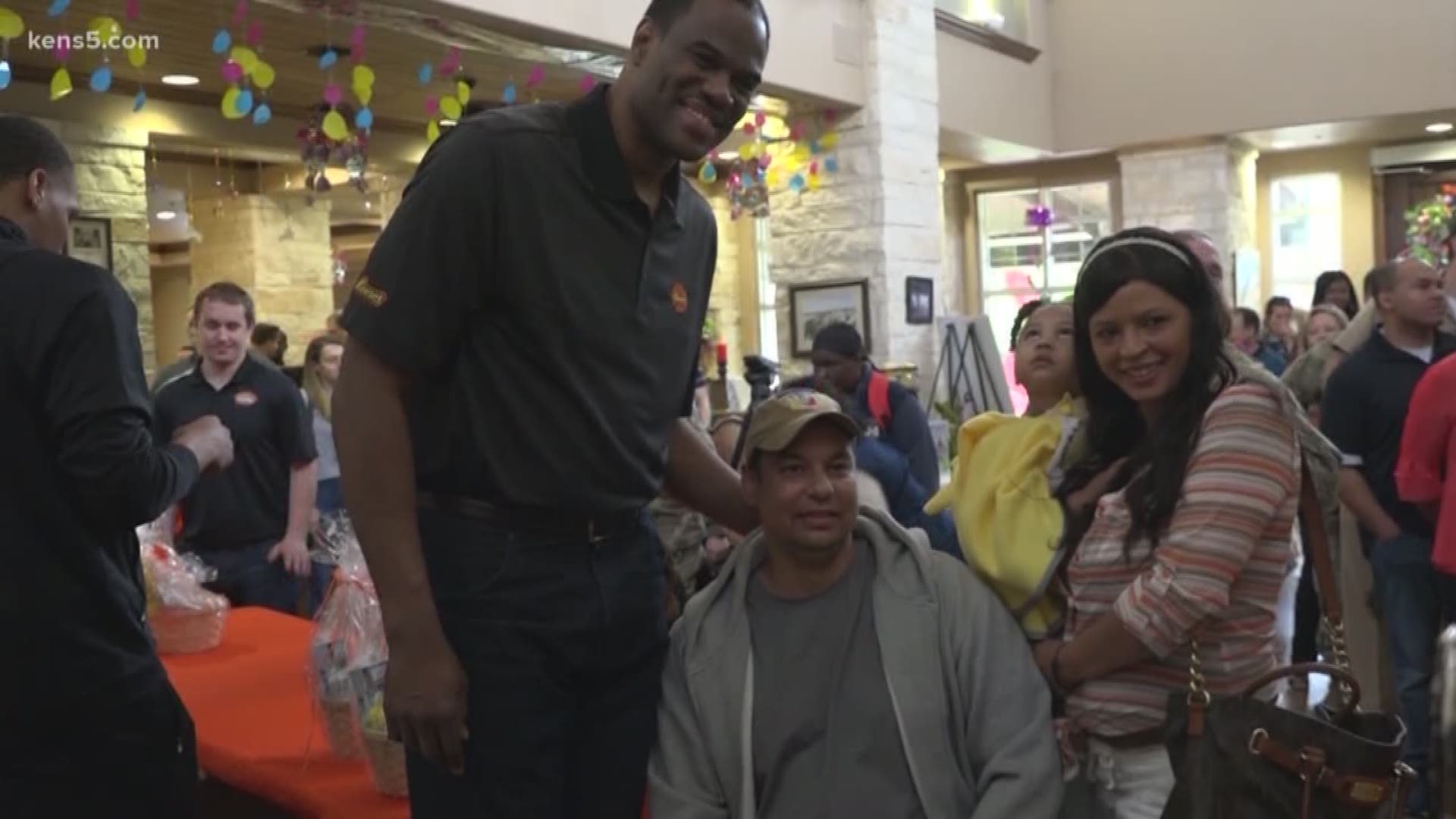 College basketball all-stars visited the Warrior and Family Support Center, with a special guest, Spurs legend David Robinson.