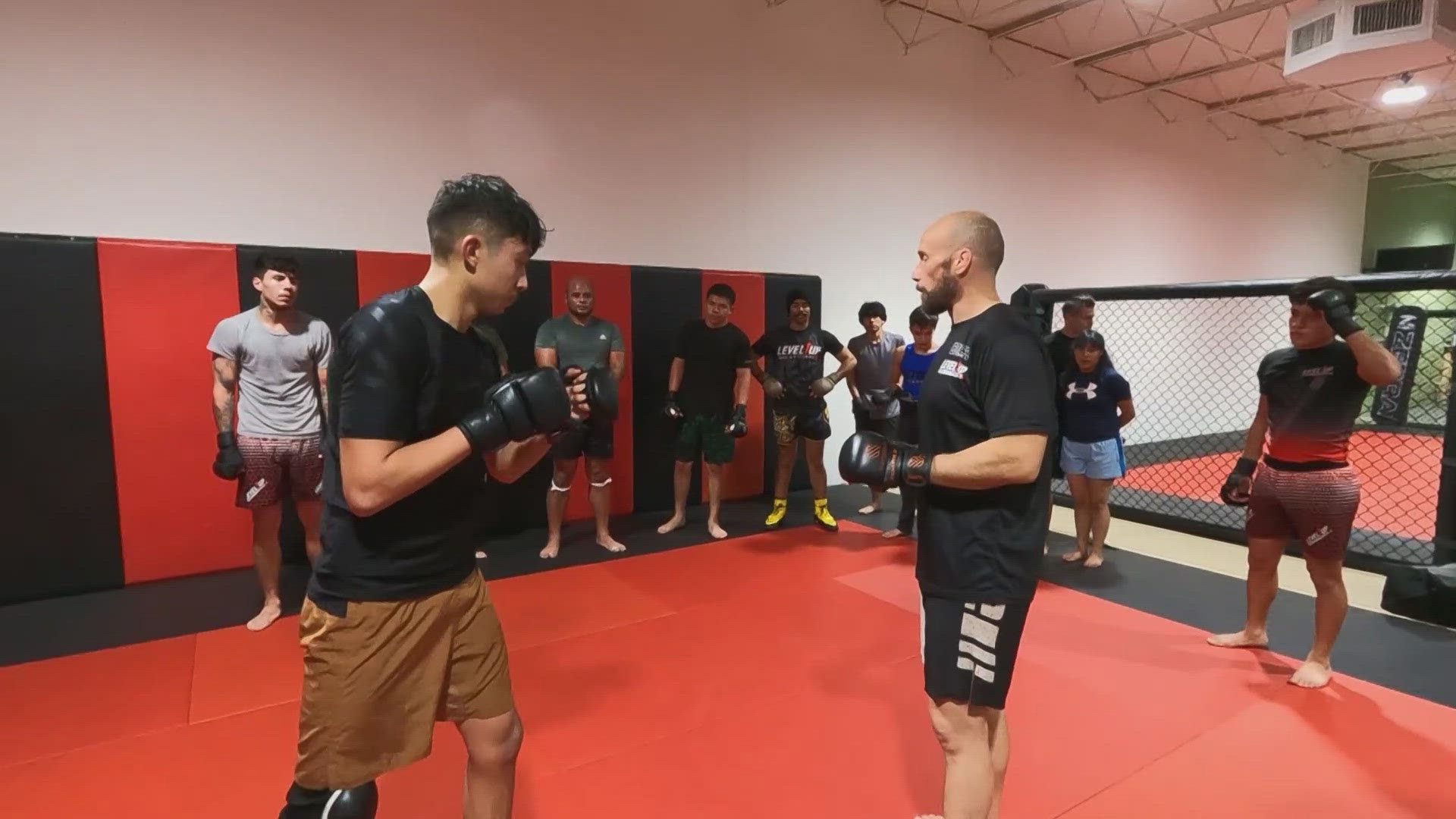A shootout broke out at a cell phone store right next to the Level Up MMA Fitness when an armed suspect shot at a clerk, sending bullets flying through the gym walls