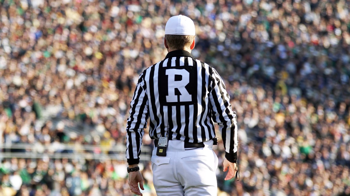 Why do NFL referees wear stripes?