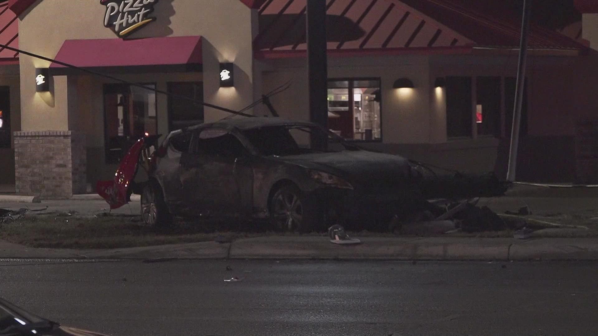 The driver crashed into a utility pole and the car caught on fire.