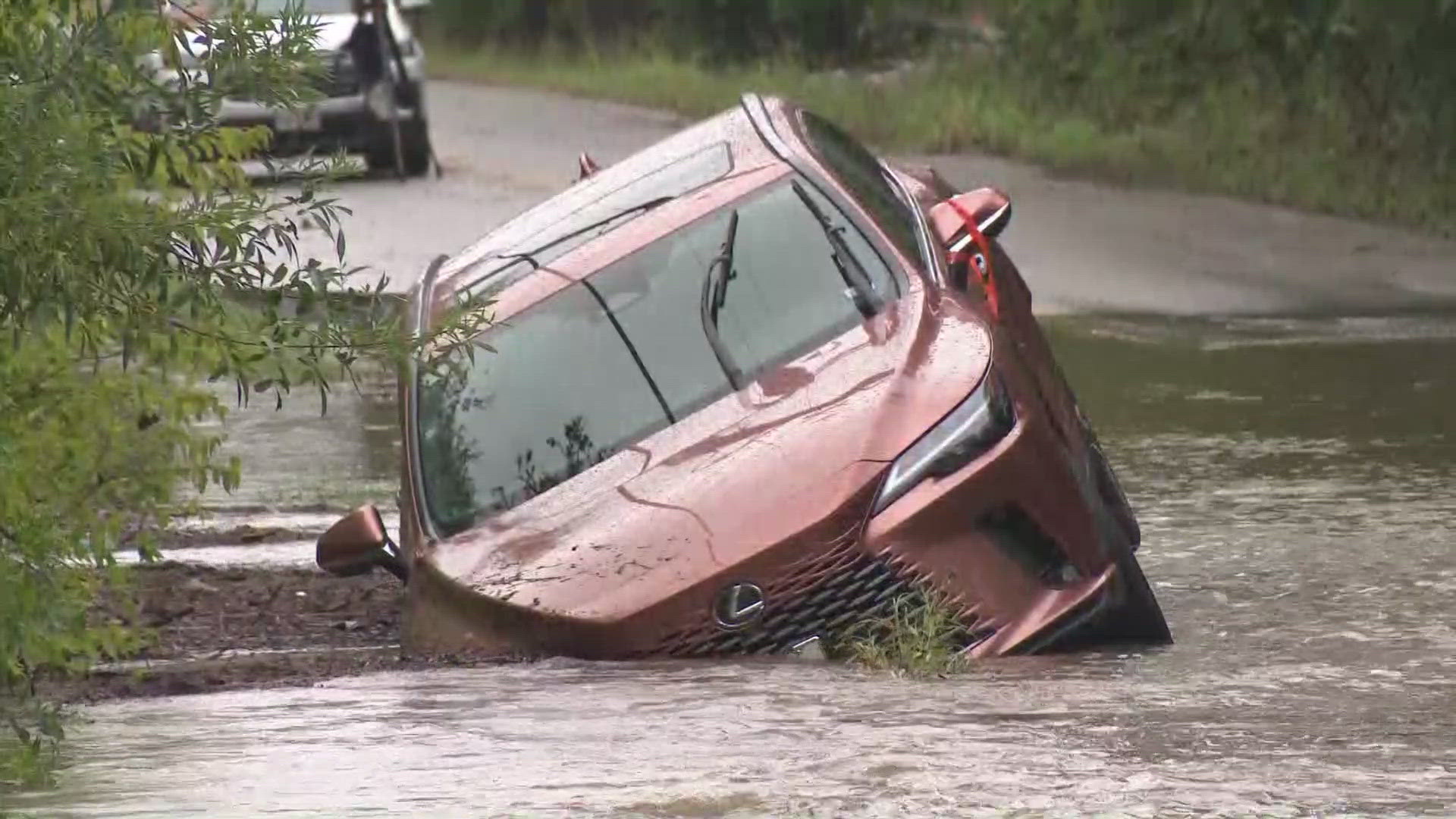 WATCH: A car is stuck in  high water at Salado Creek near Austin Highway. Police say no one is in the car and the driver got out.