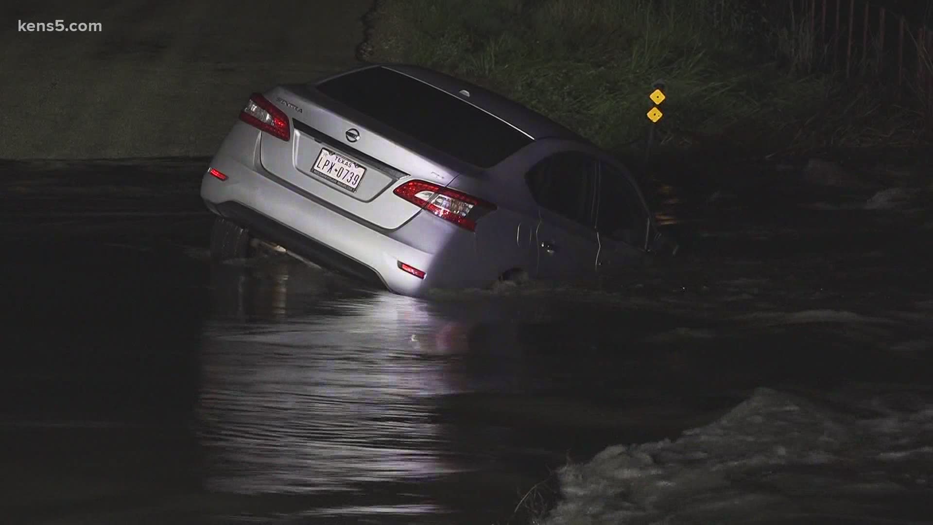 SAFD had to move quickly because they were afraid the car would be swept away by floodwaters.