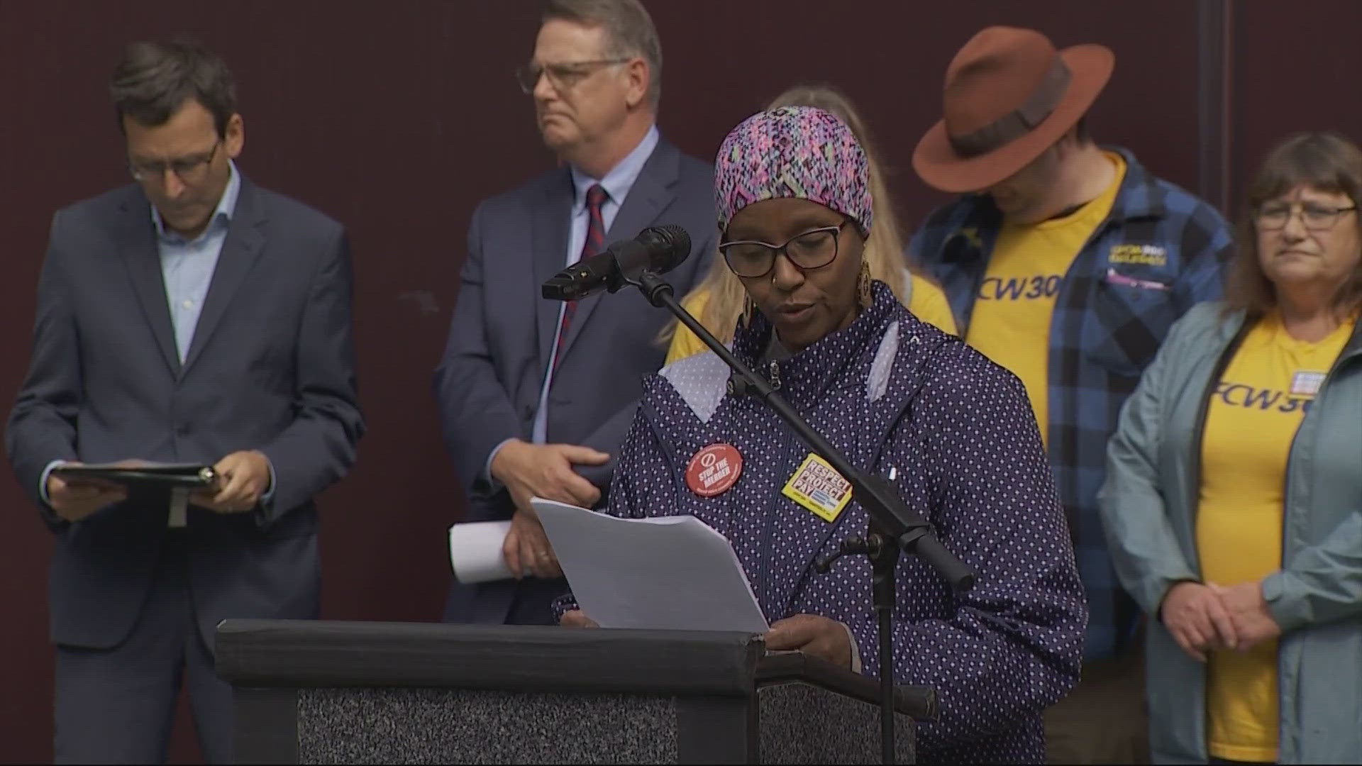 Dozens of grocery store workers protested the proposed Kroger and Albertson’s merger in Seattle on first day of the trial in Washington.