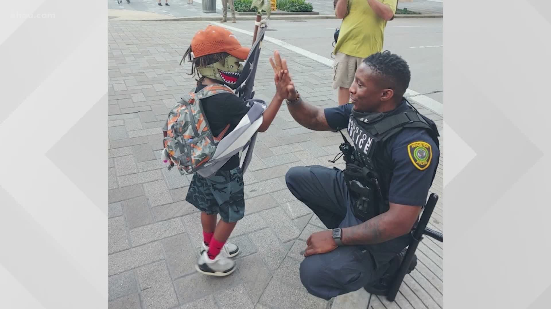 On Tuesday, in a sea of adults, the rising first-grader did what some of use are too afraid to do. He talked to a cop.