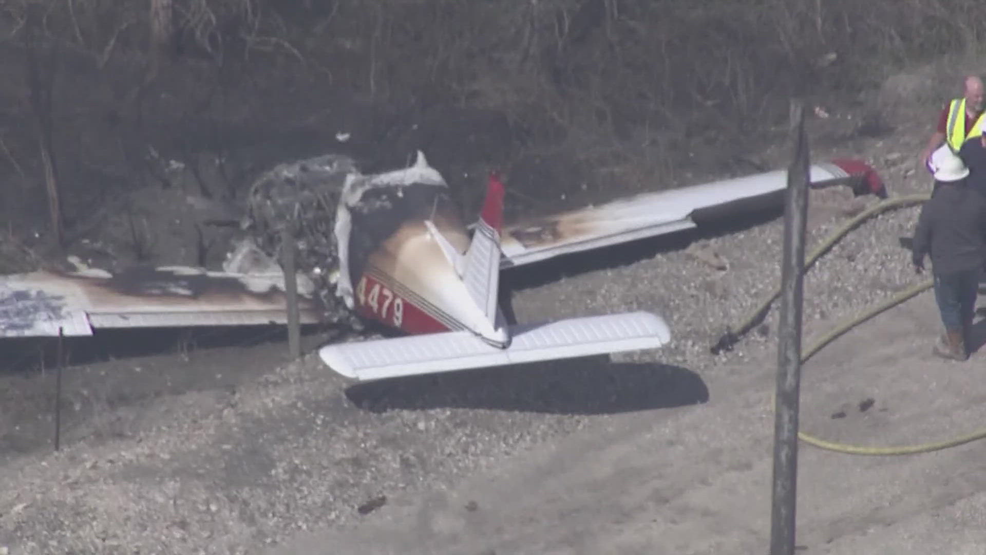 Somehow, two people walked away from the crash near County Road 285. The entire front half of the plane was destroyed. 