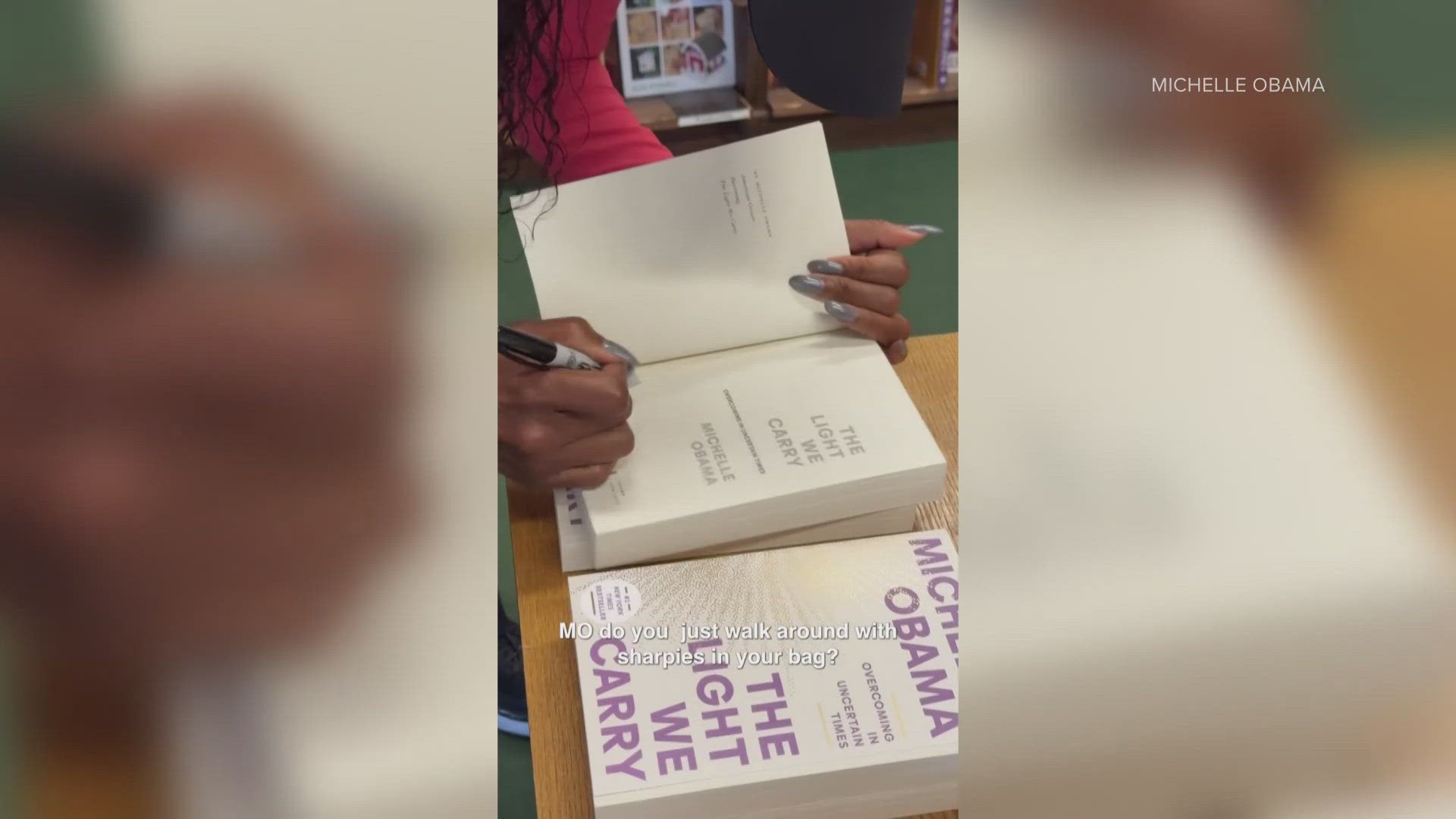 The former first lady signed copies of her book, "The Light We Carry," at Tattered Cover.