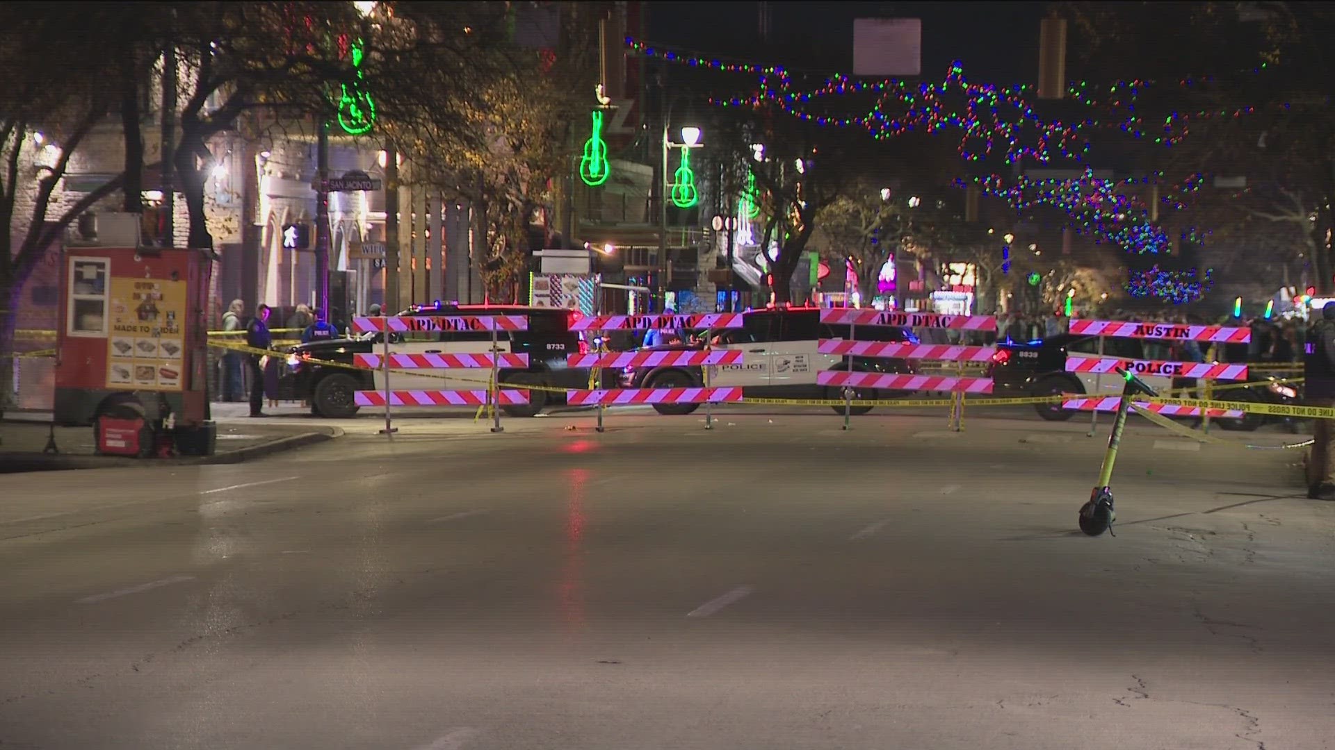 Austin police say three officers shot and killed a man who pointed a gun at officers along East 6th Street.