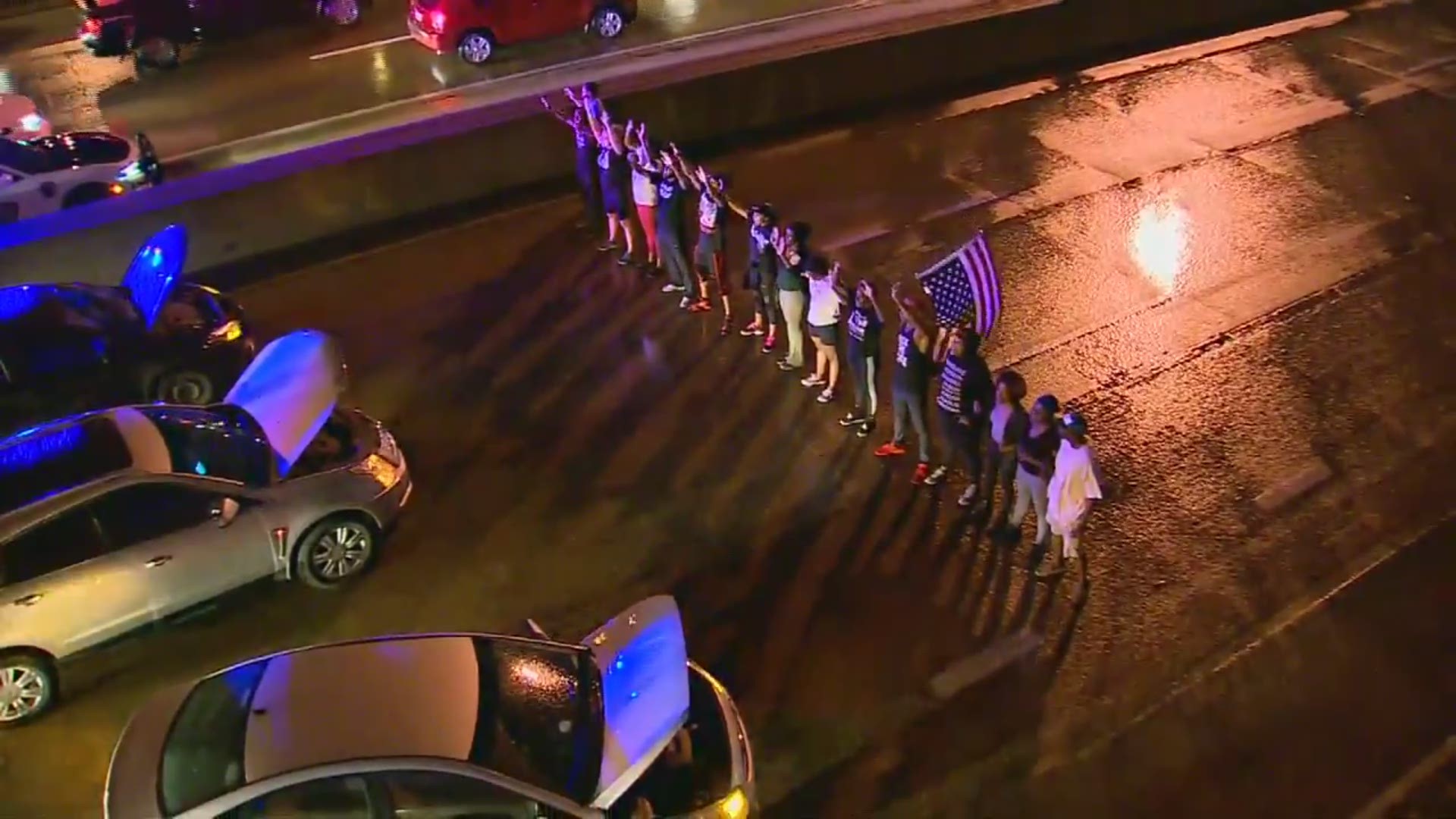 A group of protesters briefly shut down the highway near downtown Dallas on Friday night.