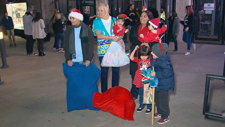 Family who received gifts from Santa’s Helpers now donates